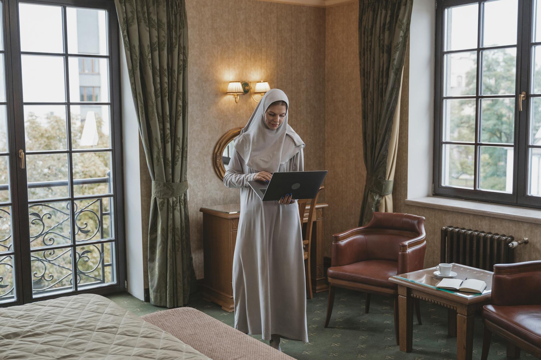 Journalist working on a laptop for Stavanger reporting-base planning.
