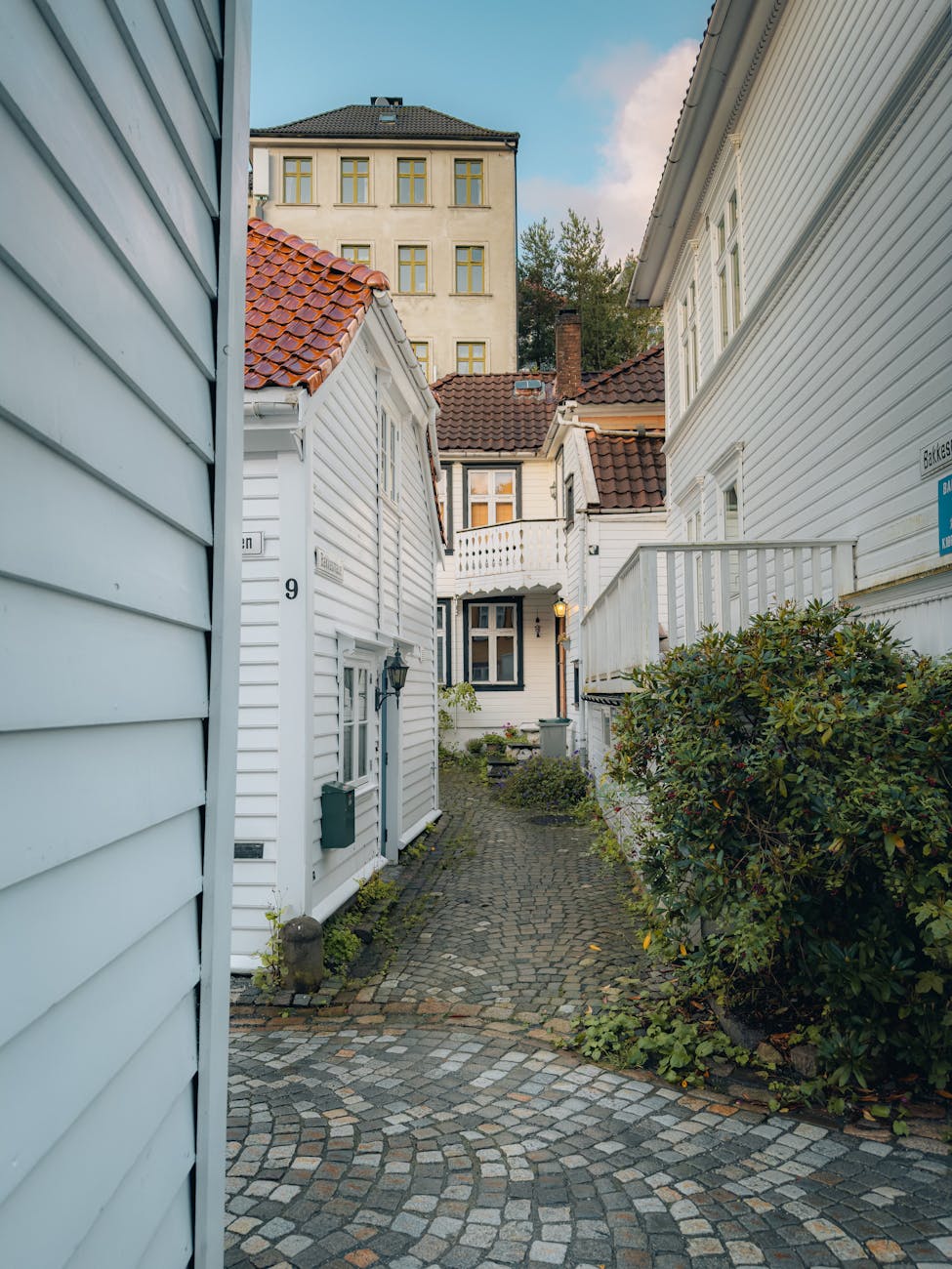 Quiet old-town street for older traveler meal and route planning.