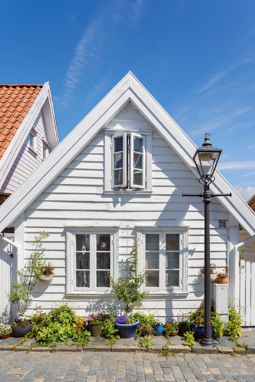 White wooden house in Stavanger for older traveler planning.