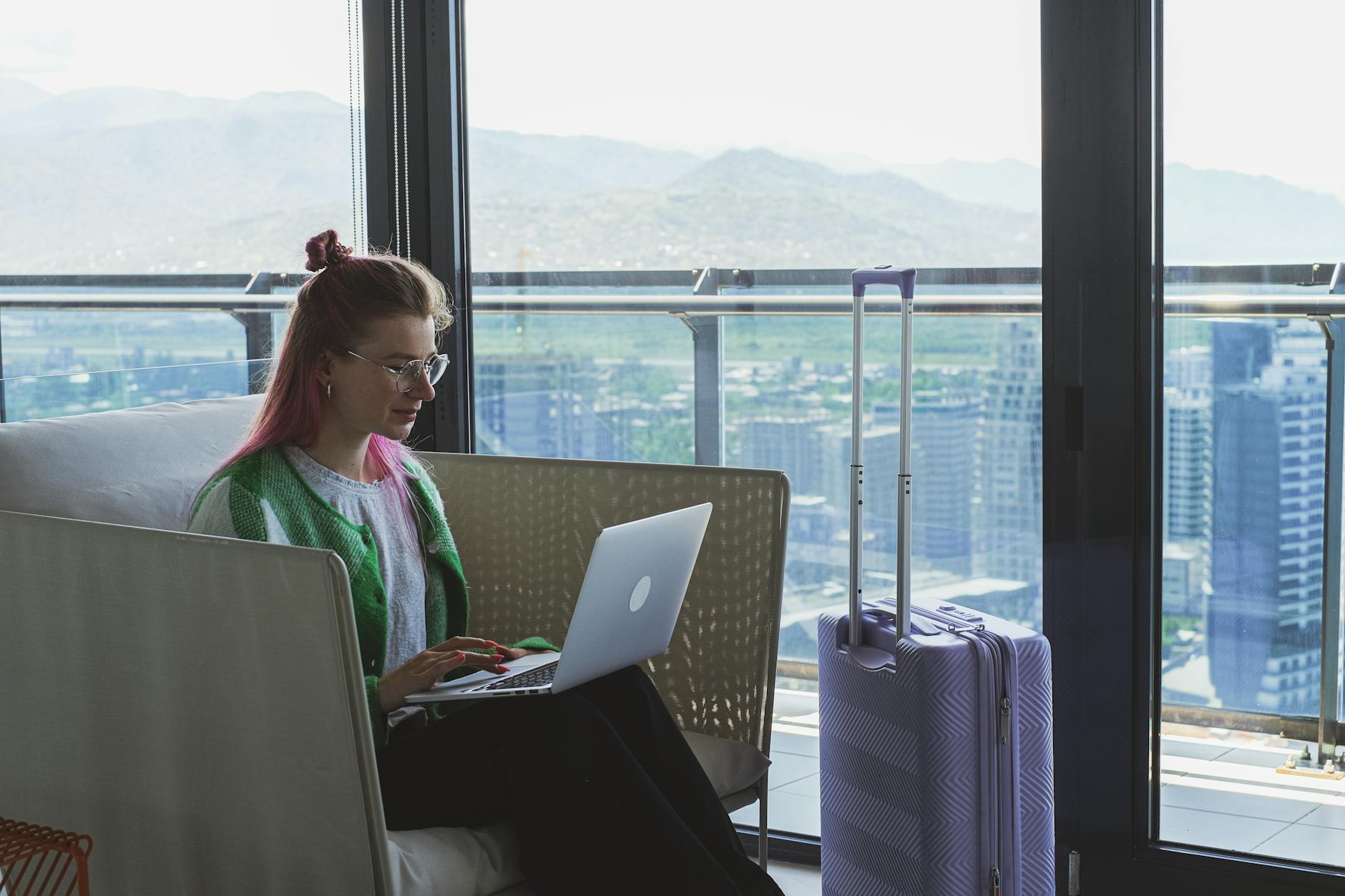 Business traveler working at a hotel table for Stavanger client-call planning.