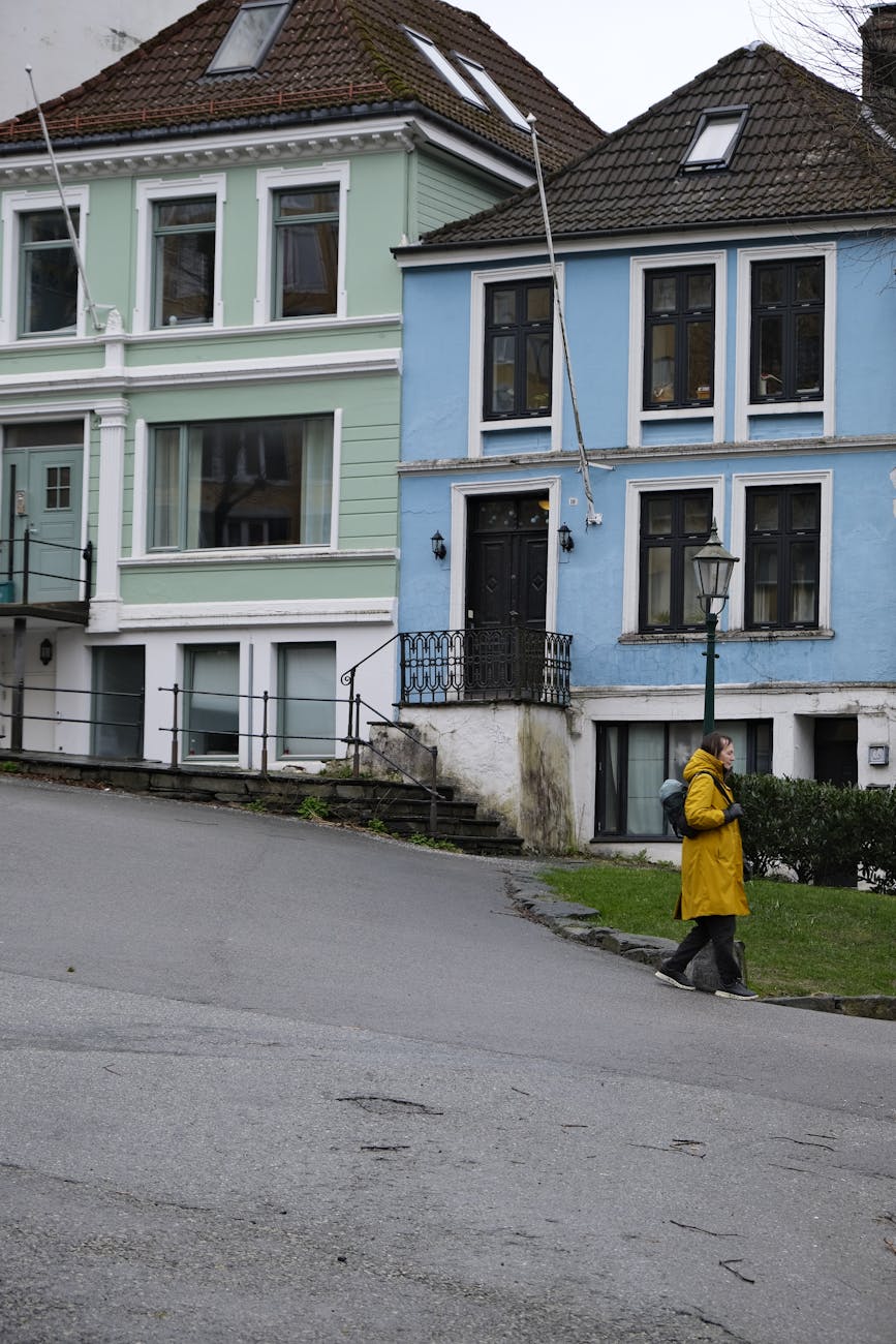 Lone pedestrian on a rainy street for Stavanger solo route planning.