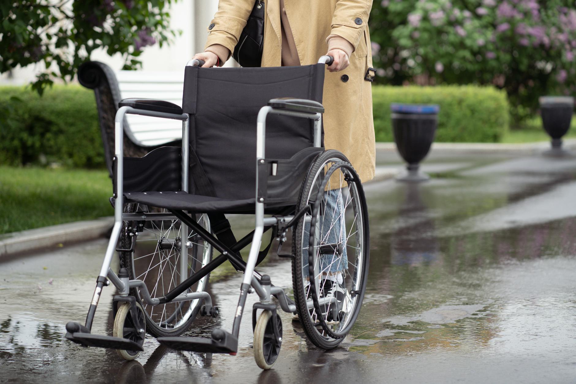 Wheelchair on a wet outdoor path for Stavanger rain-access planning.