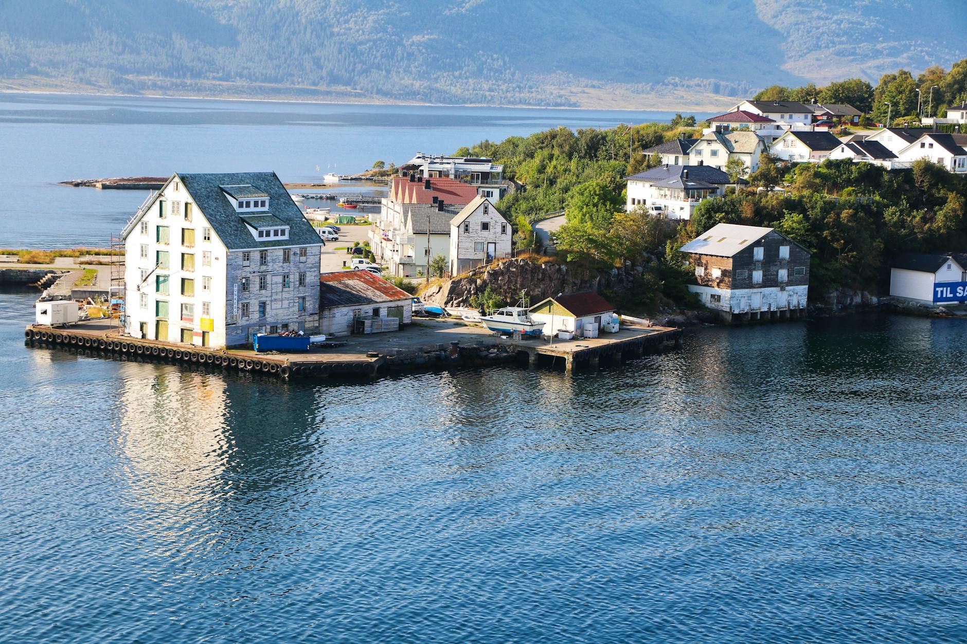 Community gathering near a harbor for Stavanger volunteer location planning.