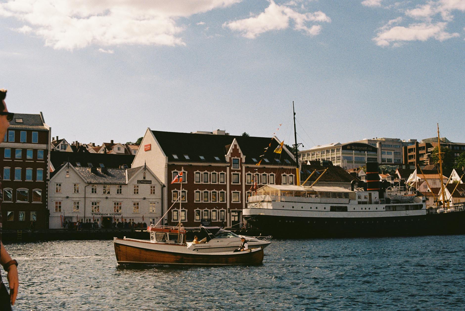 Woman at a Norwegian harbor for Stavanger evening return planning.
