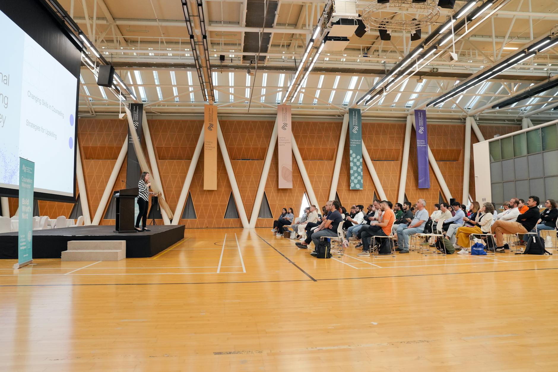 Conference audience listening to a speaker for Stockholm presentation planning.