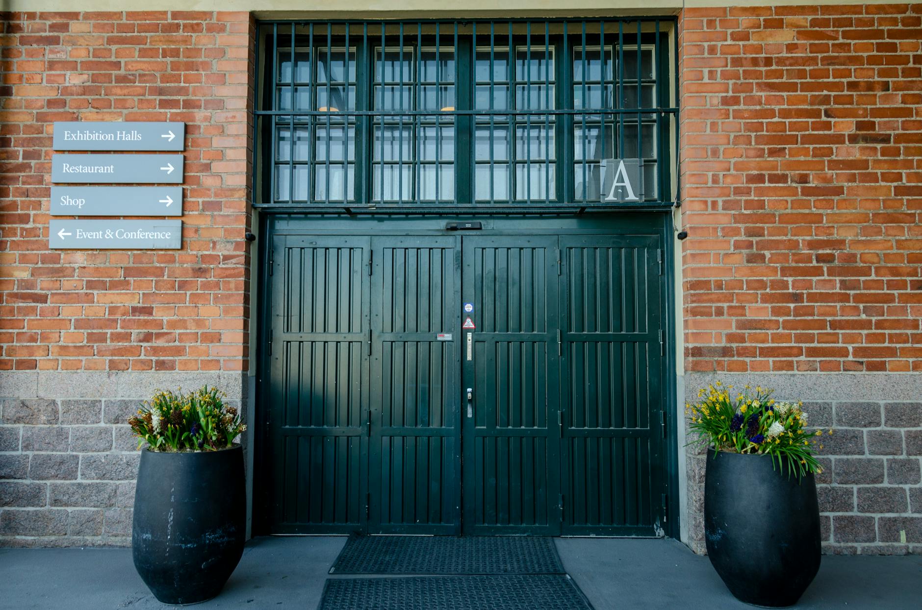 Historic academic building entrance for Stockholm conference planning.