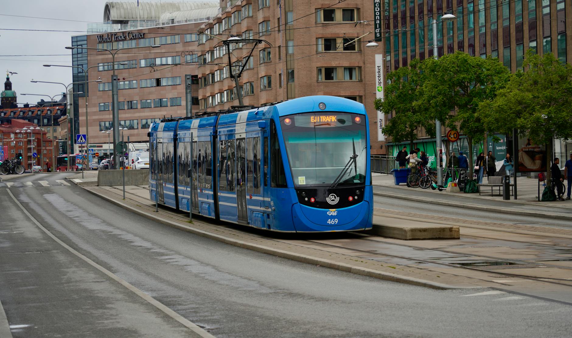 Blue tram in Stockholm for budget luggage and movement planning.
