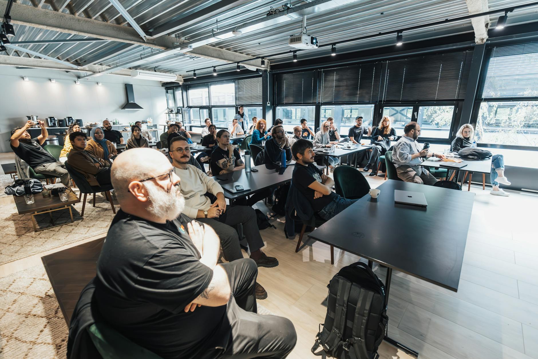 People in an office meeting for Stockholm business-day planning.