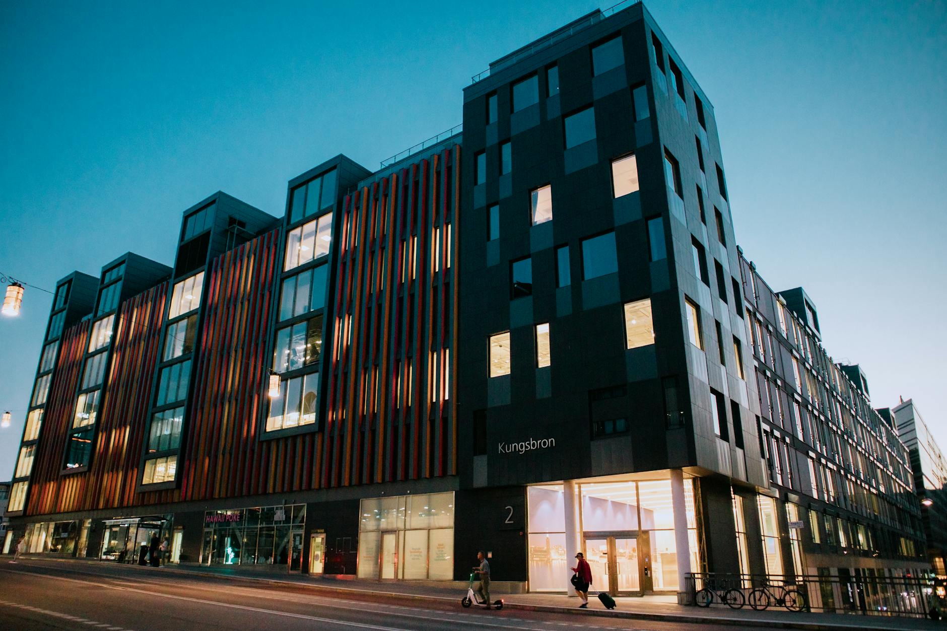 Modern Stockholm office building at twilight for arrival planning.