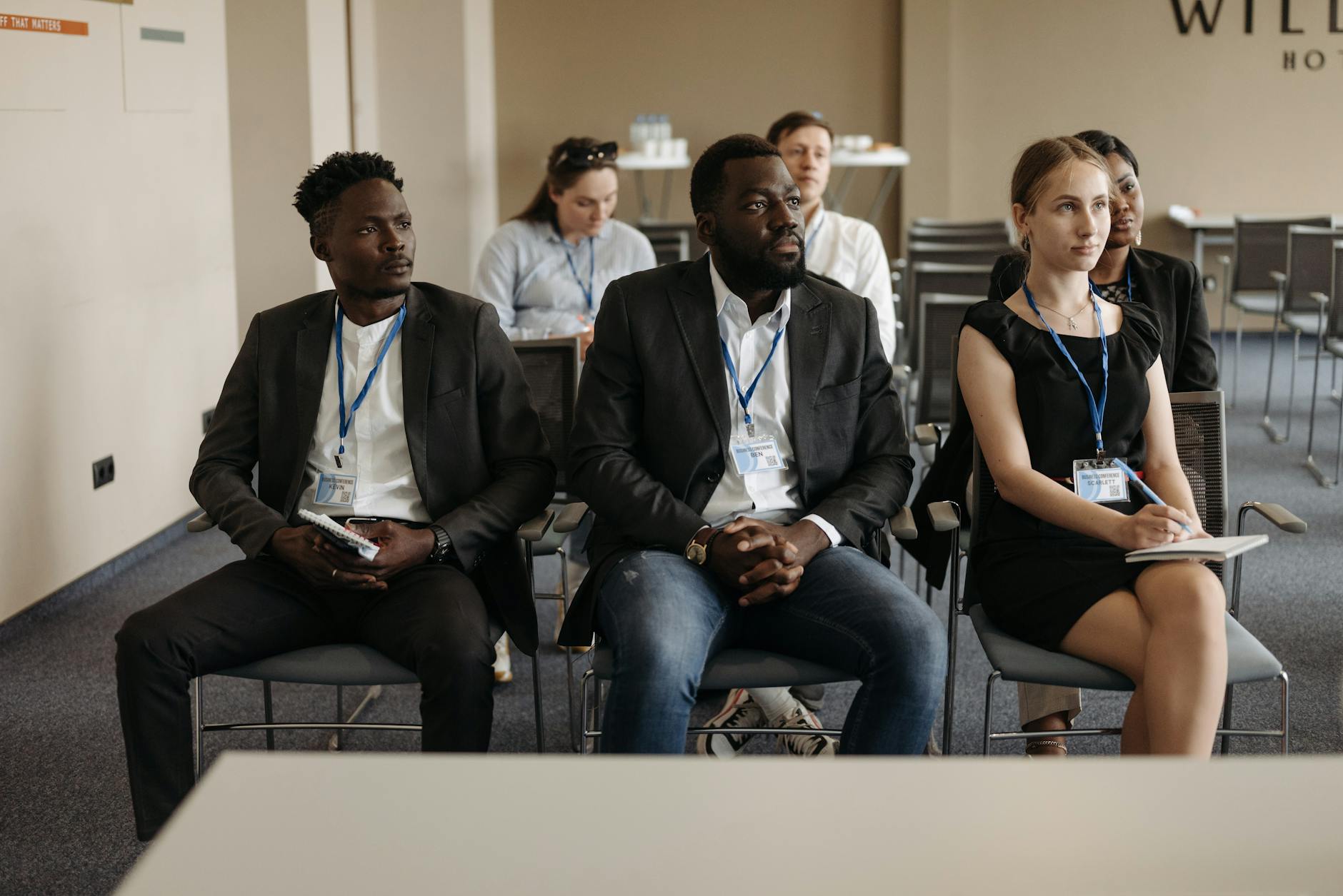 People listening in a business seminar for conference venue planning.