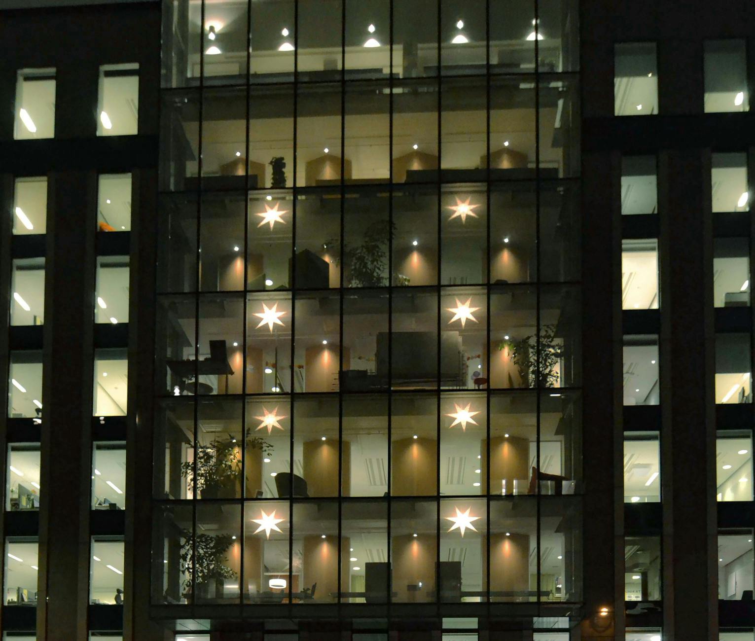 Stockholm office building at night for investor travel planning.