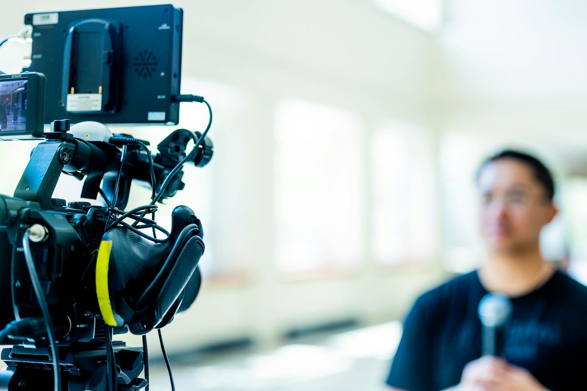 Professional video camera setup for Stockholm journalist interview planning.