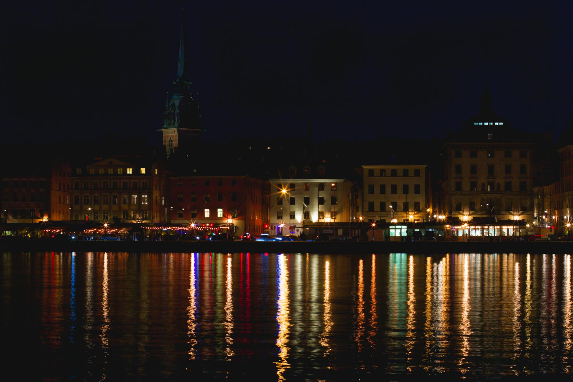 Stockholm illuminated waterfront at night for nightlife travel planning.