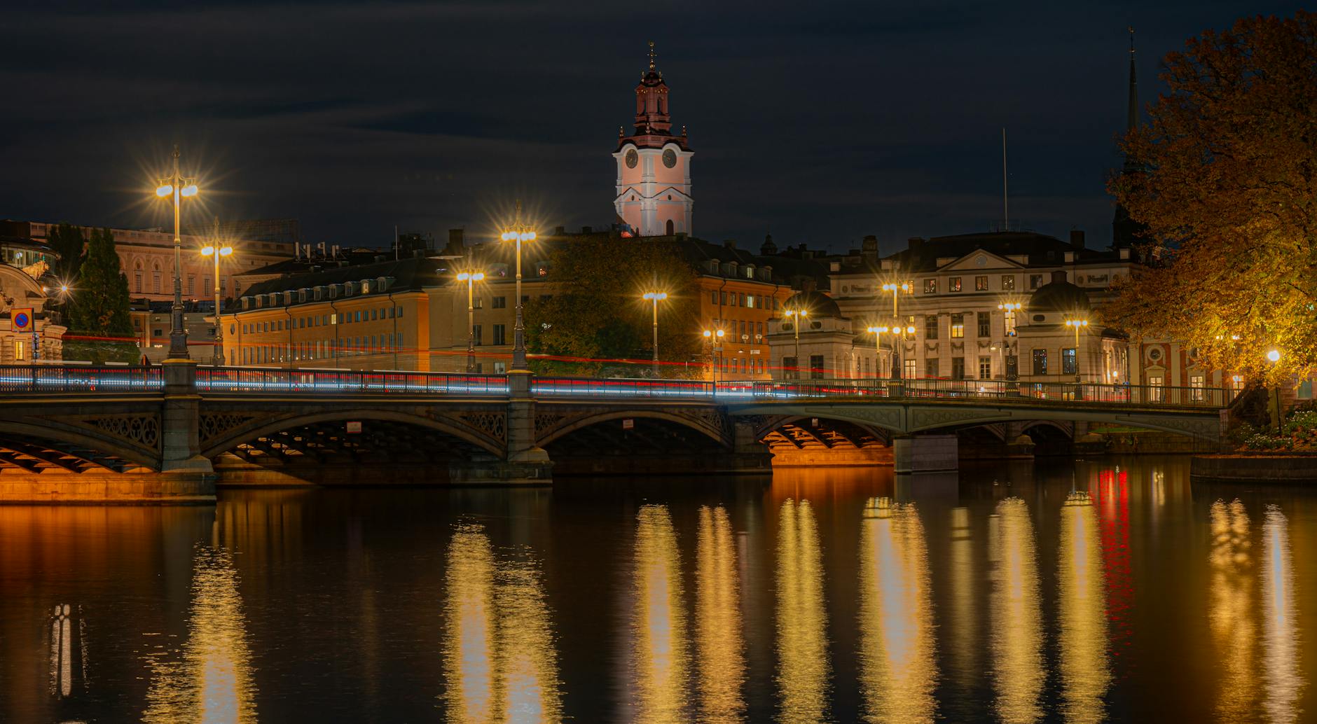 Riddarholmen night bridge lights for Stockholm late-return planning.