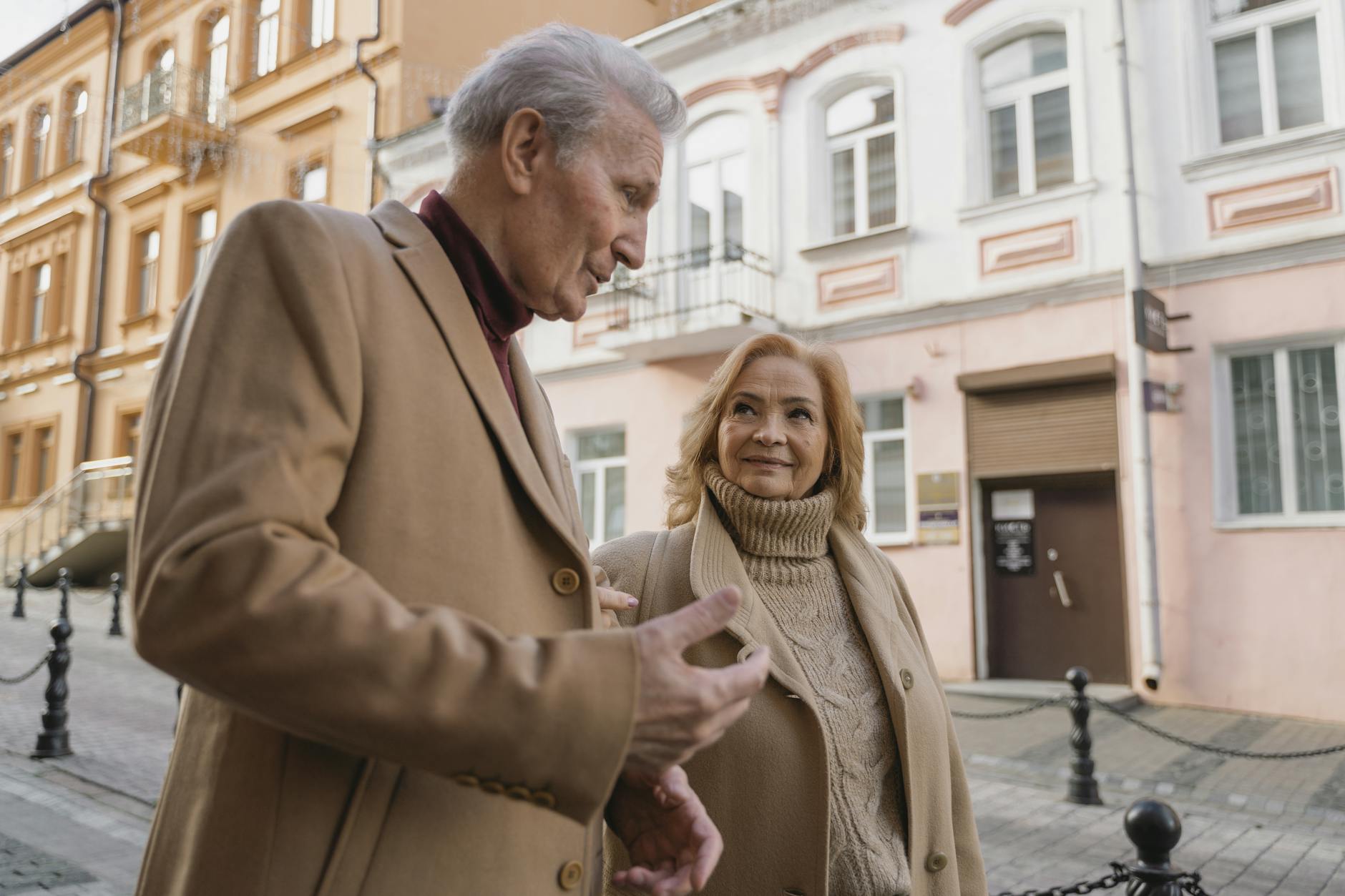Older couple walking together for Stockholm transit and taxi planning.