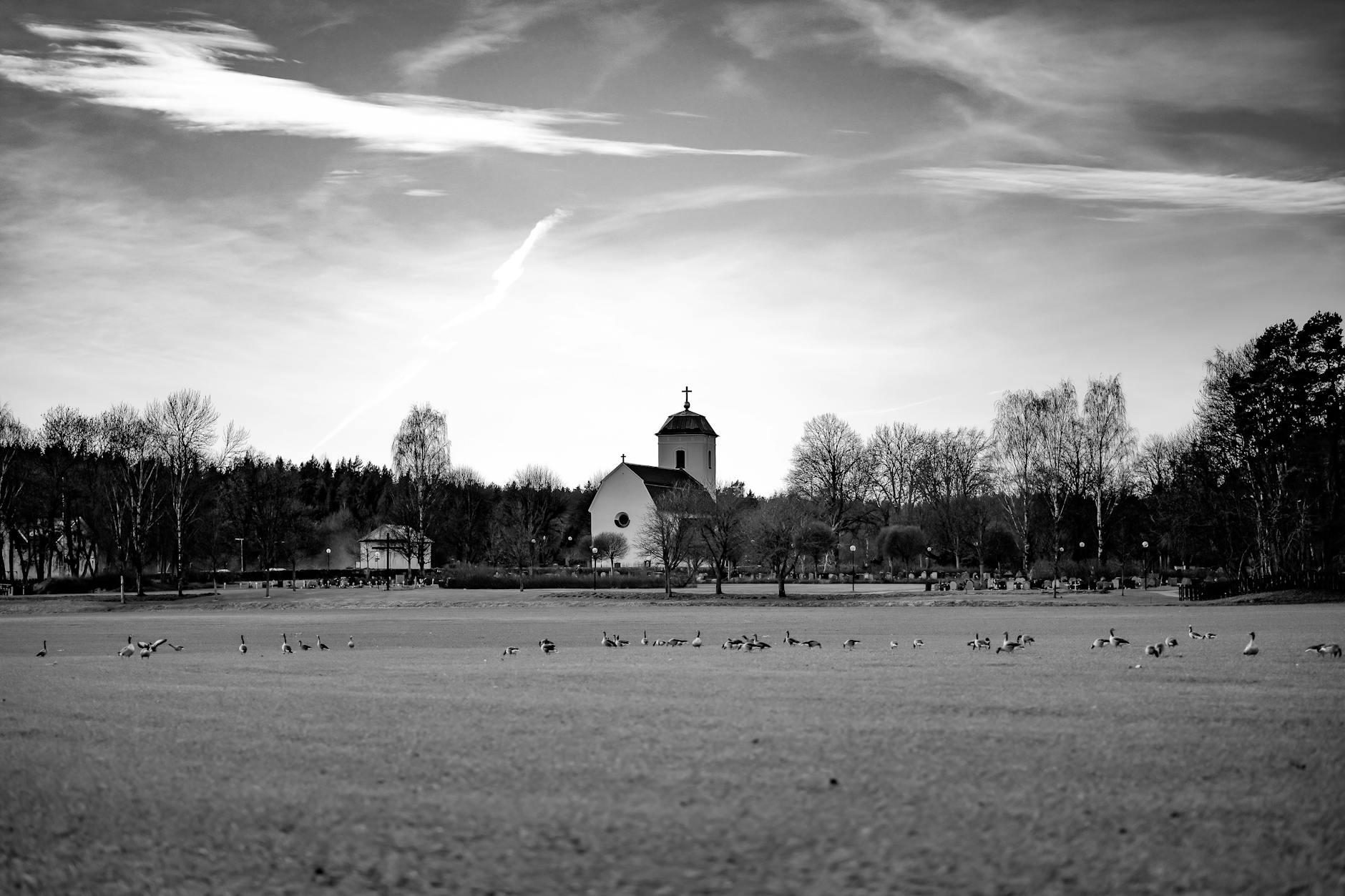 Black and white Stockholm church scene for pilgrimage travel report planning.