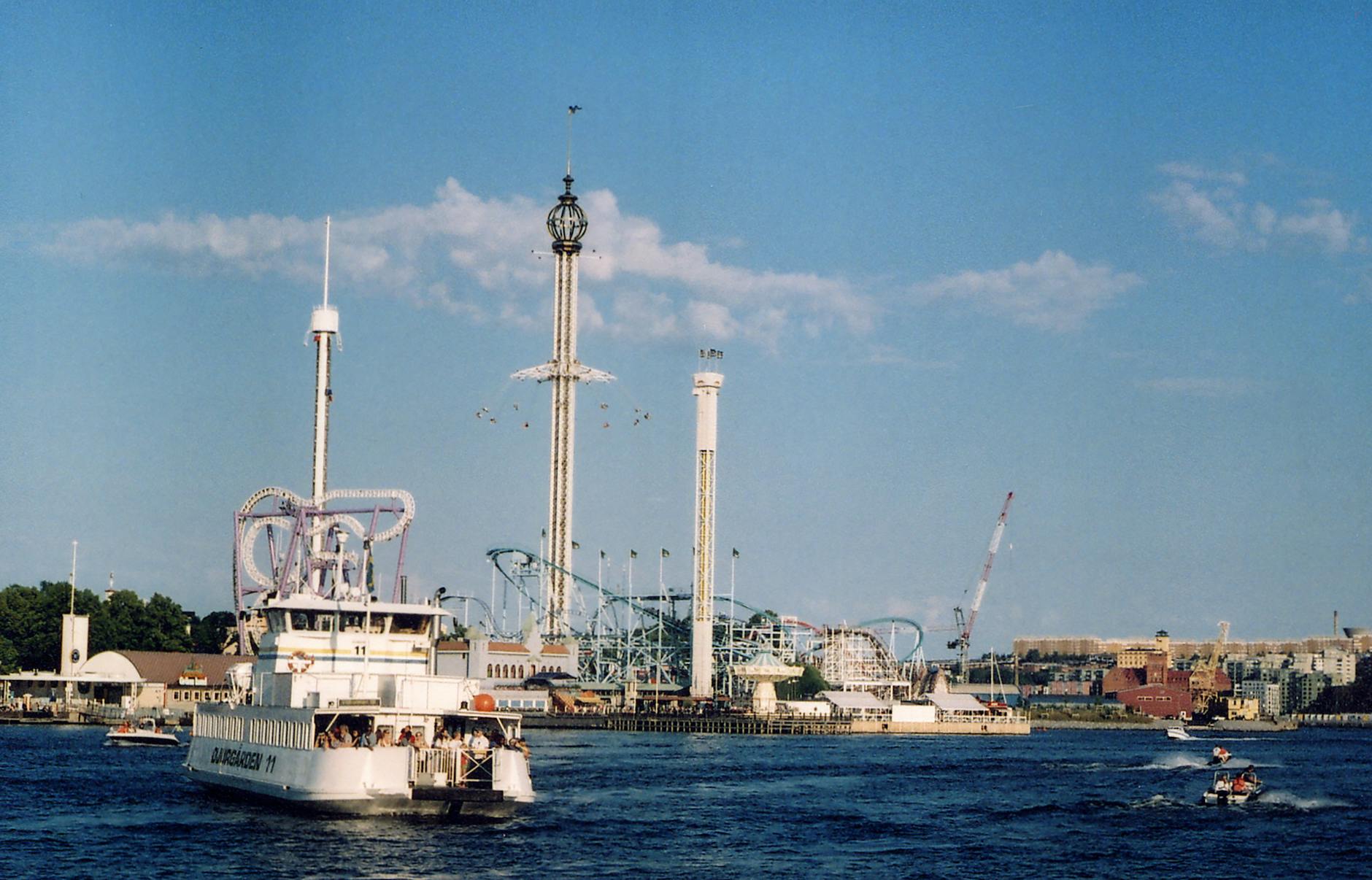 Ferry passing a Stockholm amusement park for repeat visitor water planning.
