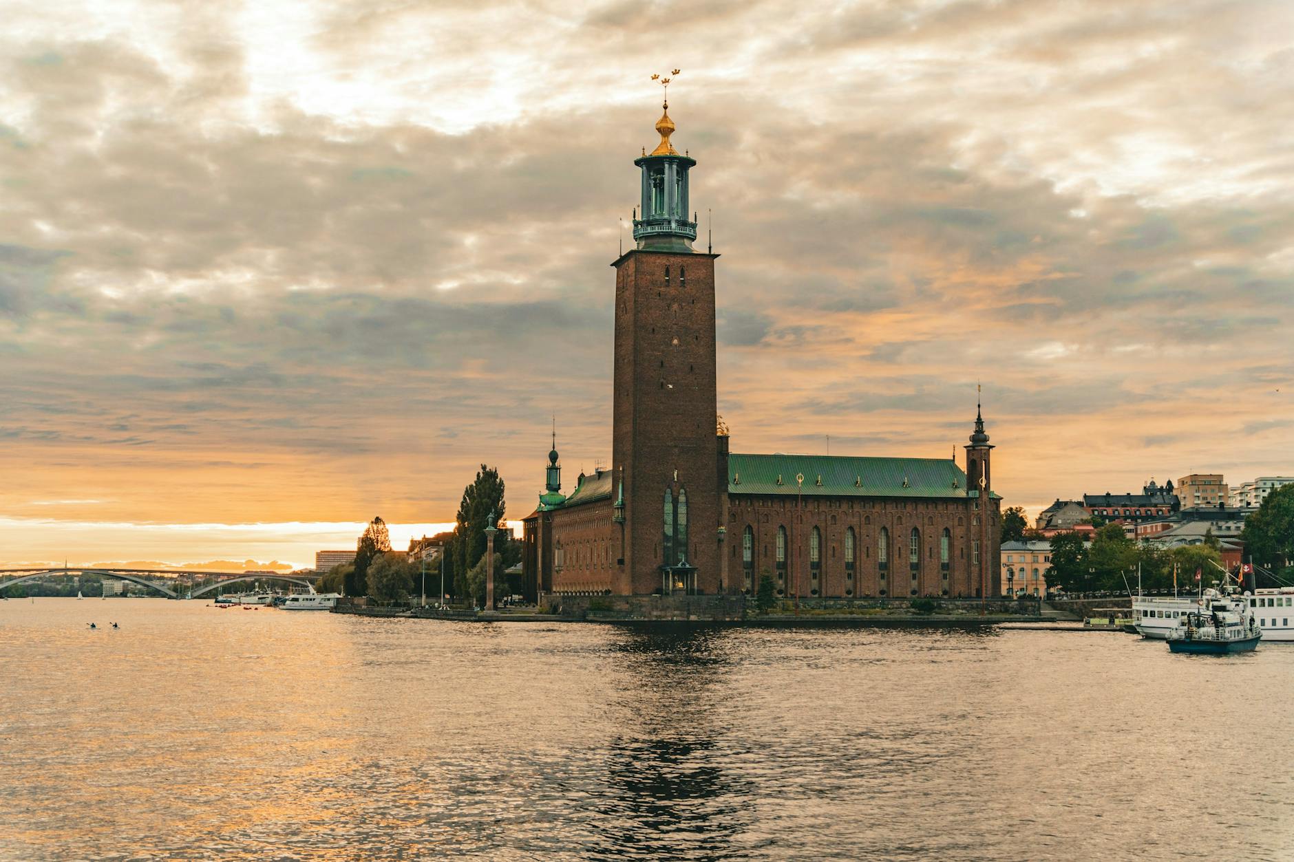 Stockholm City Hall at sunset for sales travel report planning.