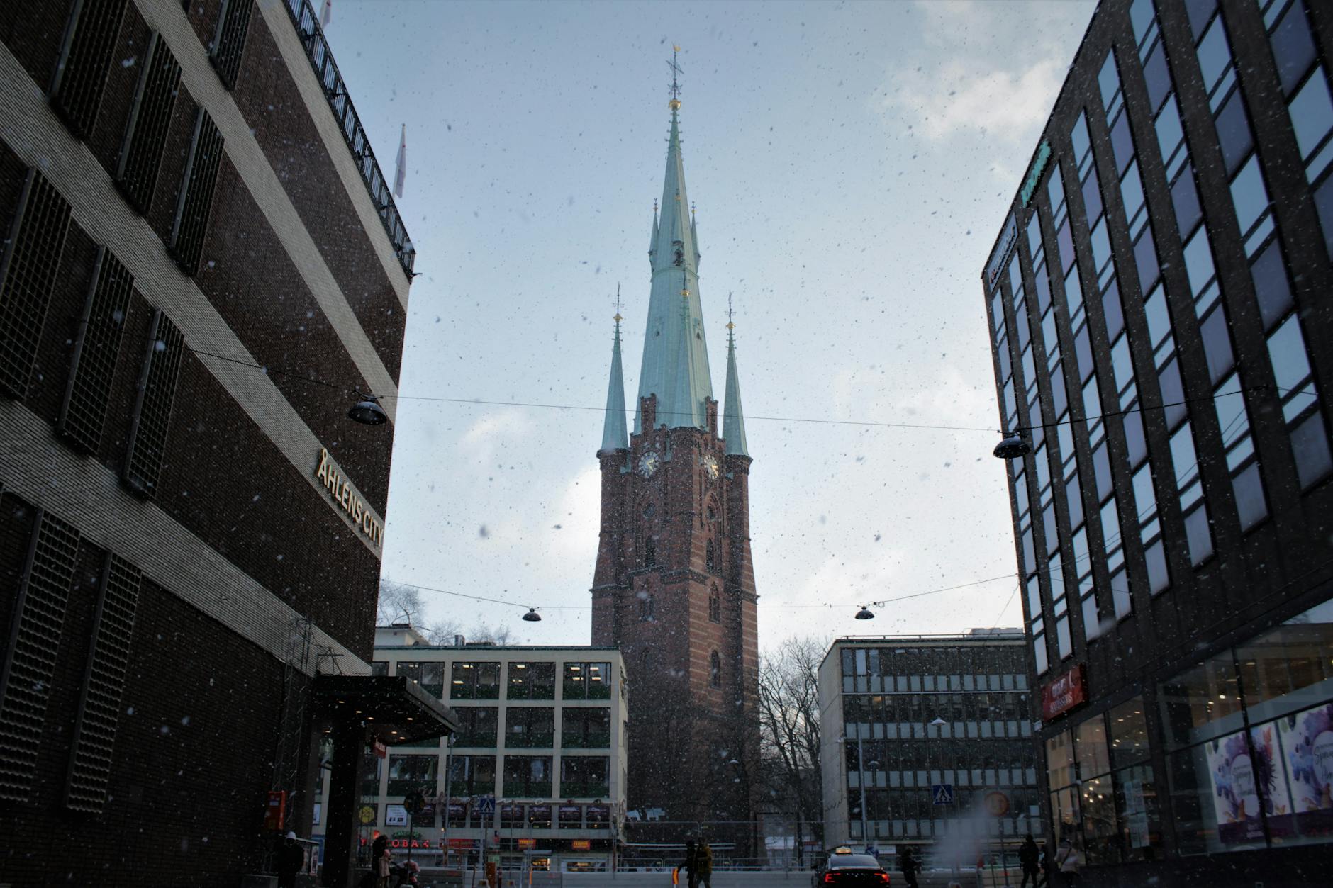 Snowy Klara Church in Stockholm for solo weather planning.