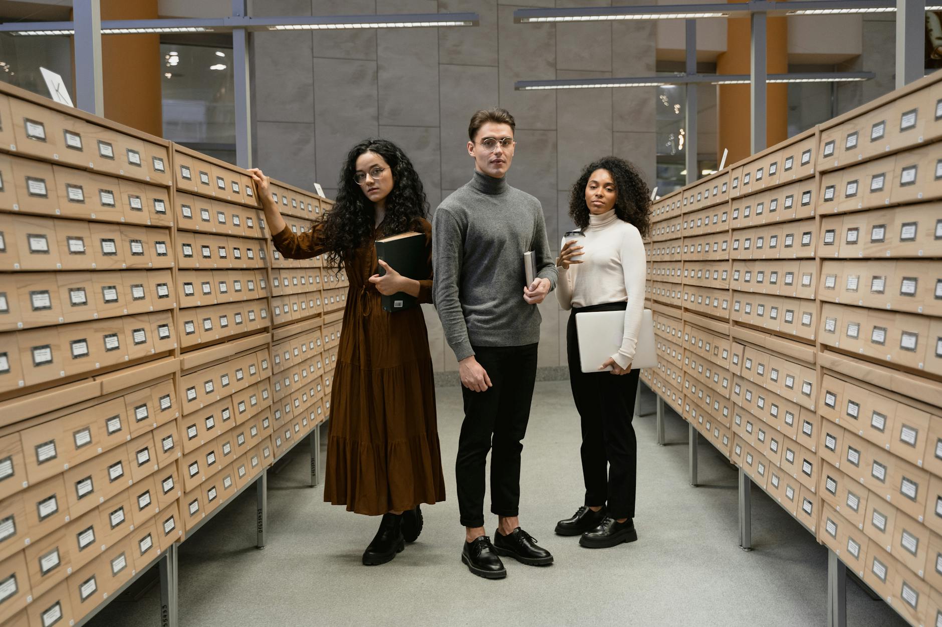 Students researching in a library for Stockholm short-program housing planning.