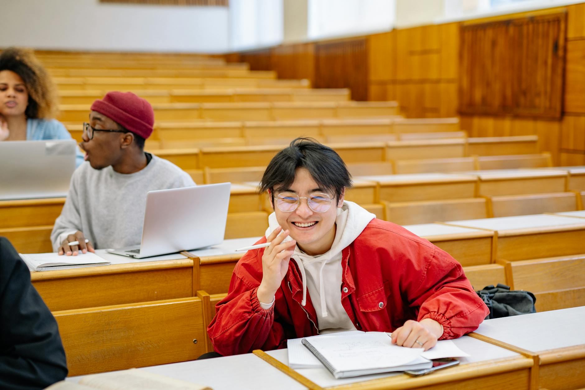 University students studying together for Stockholm short-program travel report planning.