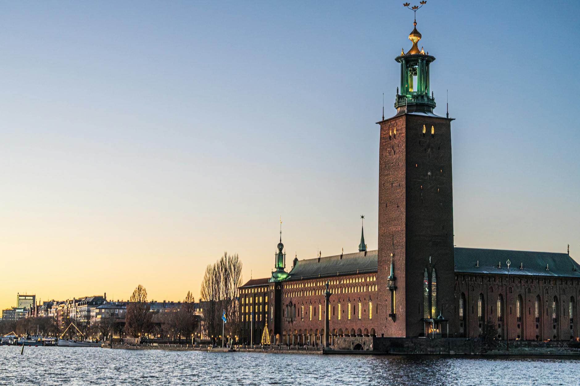 Stockholm City Hall reflecting on the water for tourist route planning.