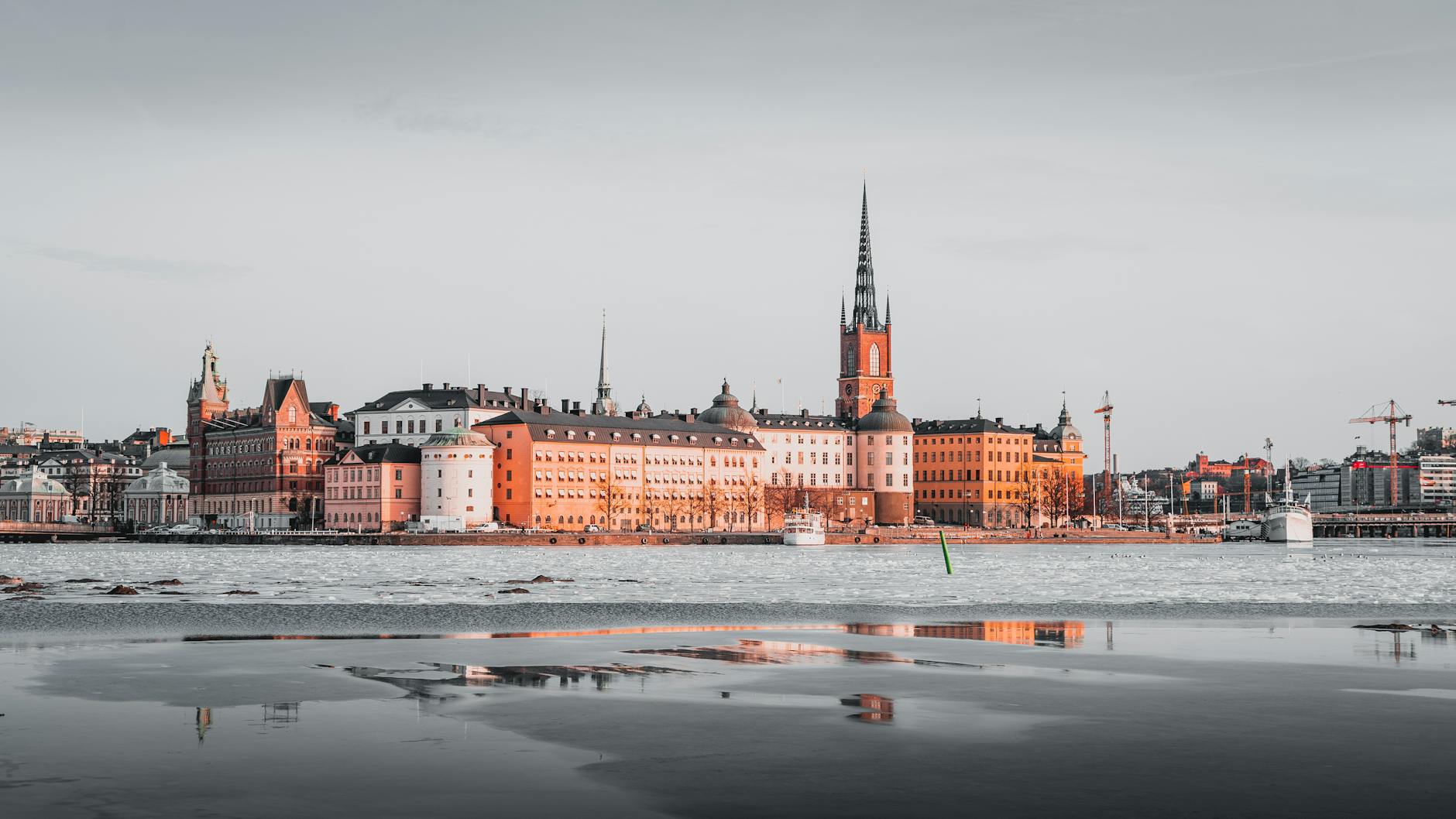 Stockholm skyline reflected on icy water for tourist priority planning.