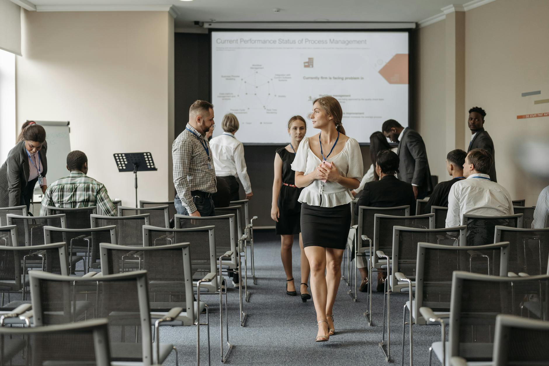 Professionals at a business conference for Stockholm trade-show report planning.