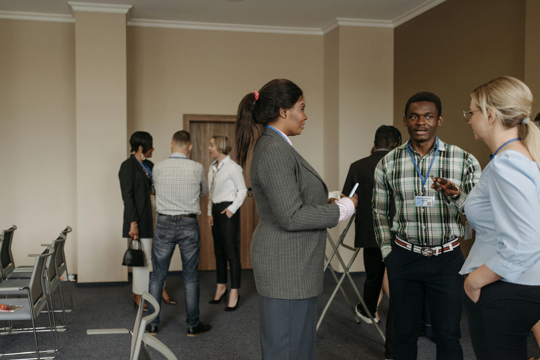 Professionals networking at a trade show for Stockholm attendee planning.