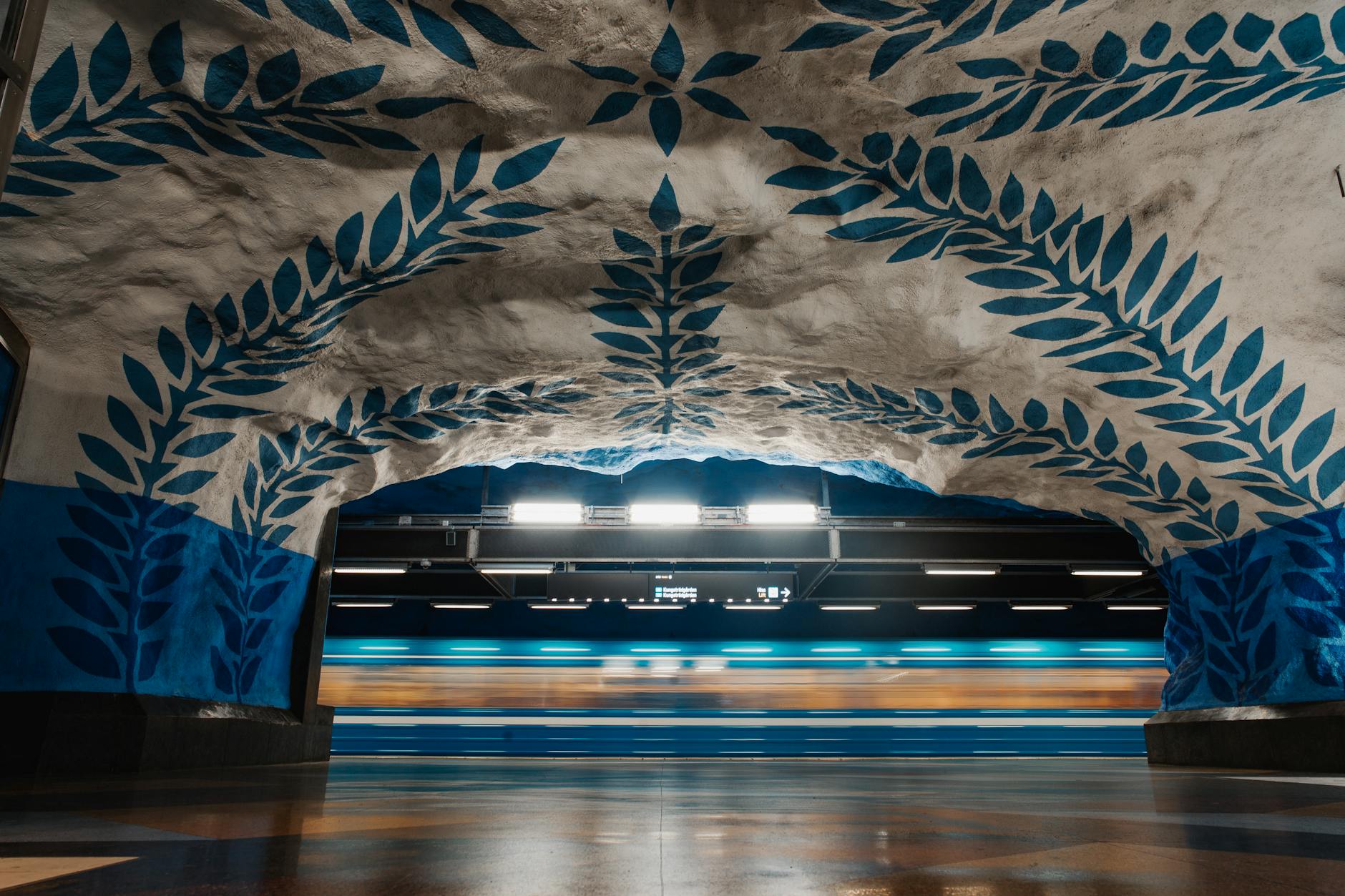 Stockholm metro blue leaf murals for compact stopover route planning.