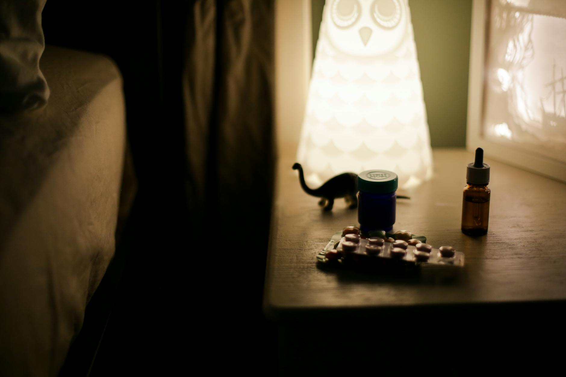 Medication near a bedside table for medical rest and transport planning.
