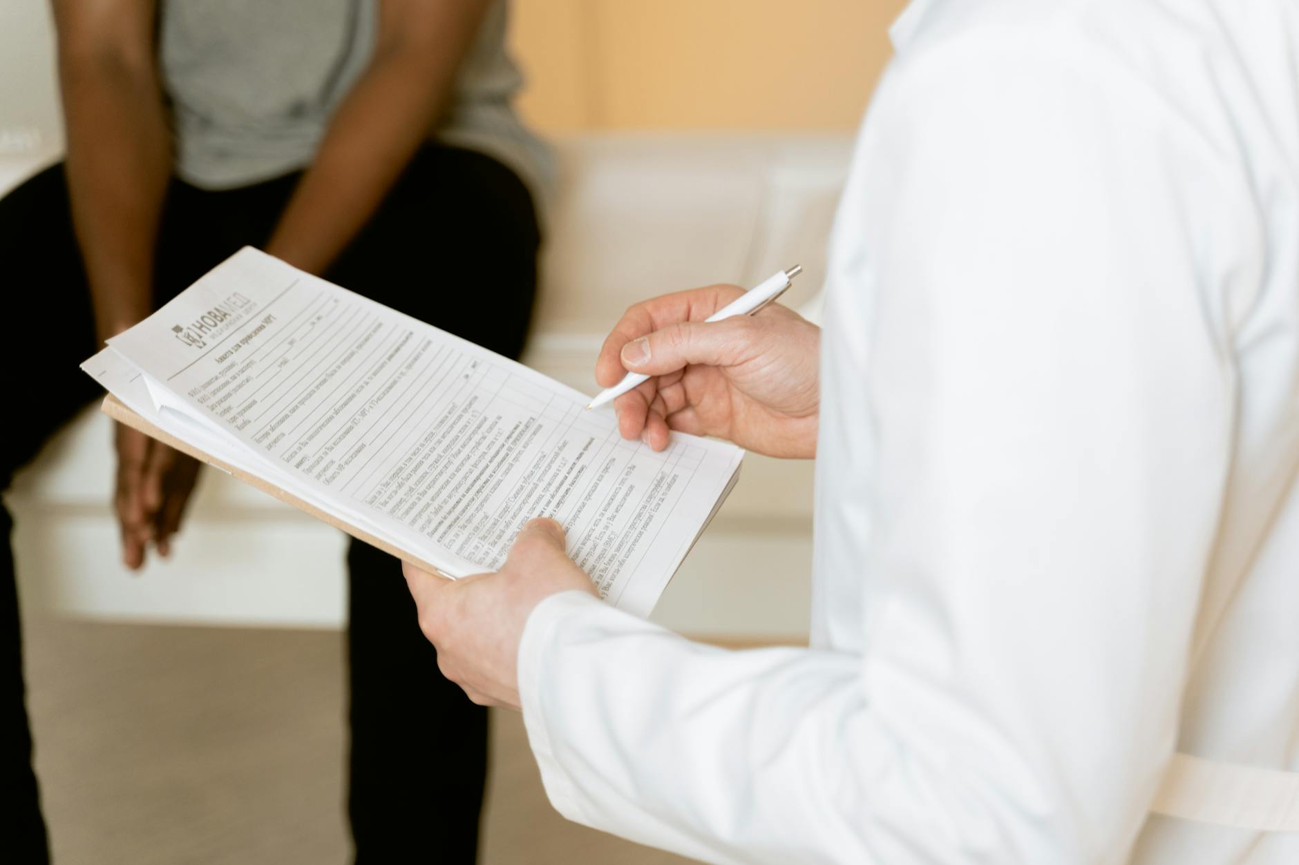 Clinician reviewing paperwork for medical travel preparation.