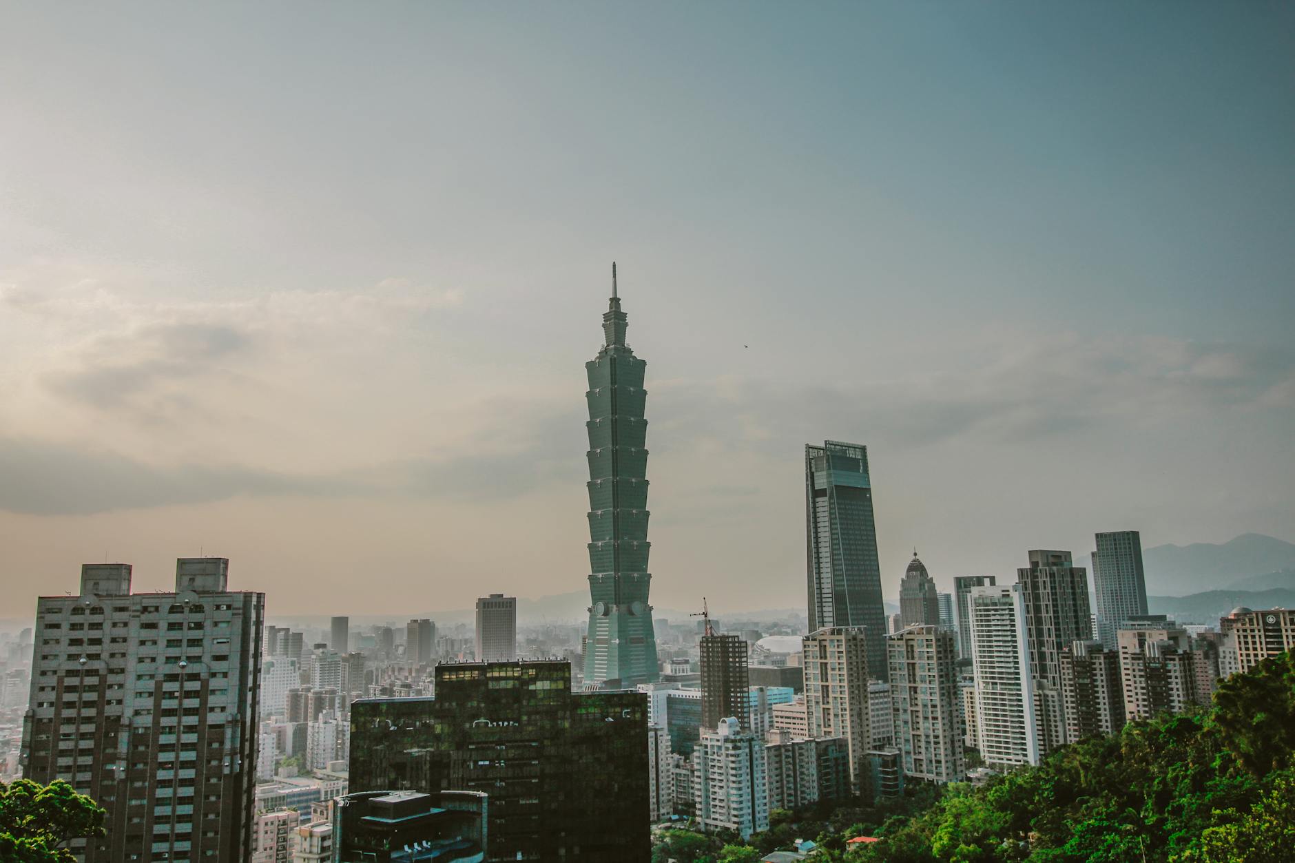 Taipei academic conference attendee and city skyline planning context.