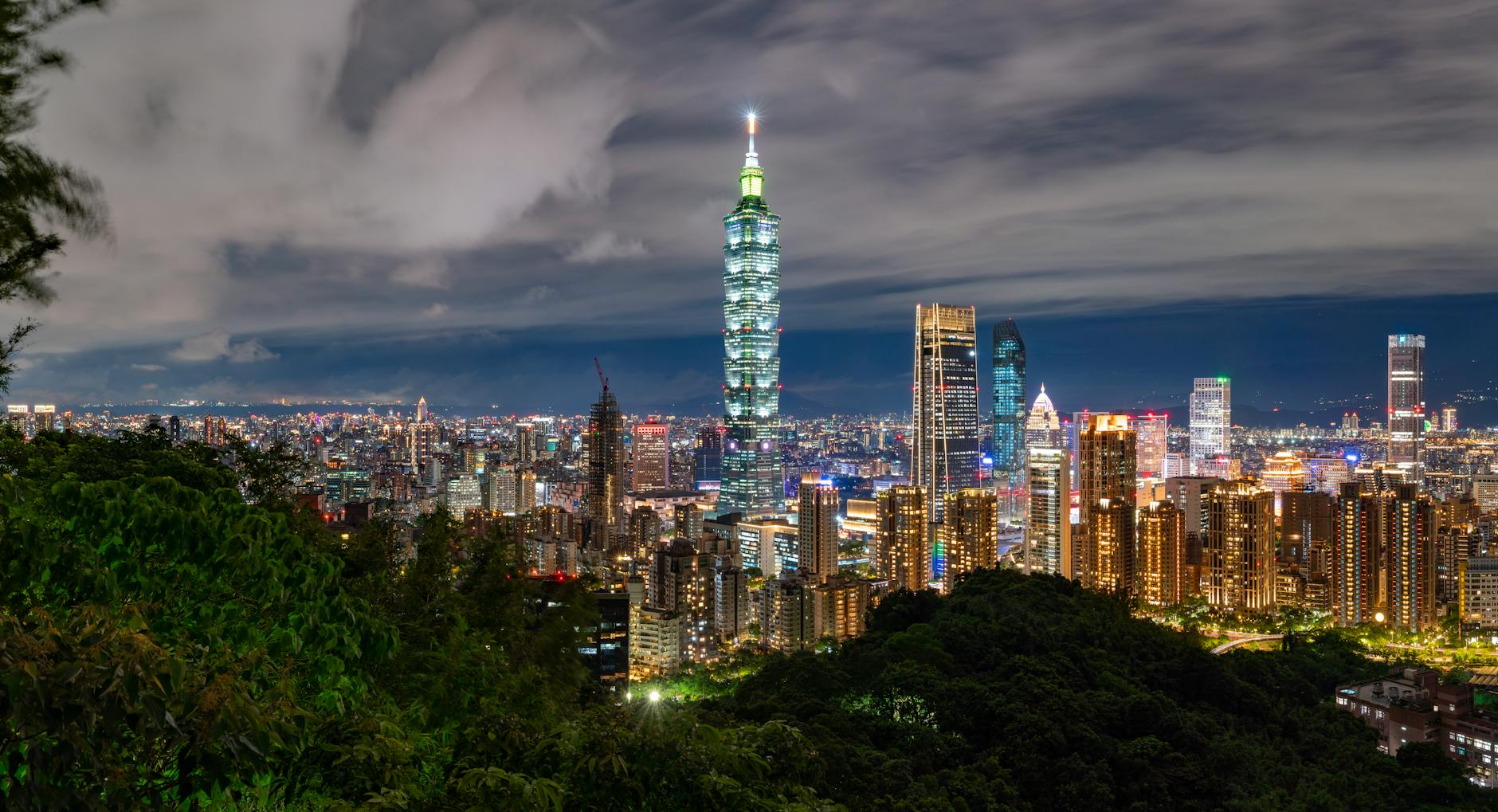 Taipei mountain skyline and outdoor traveler planning context.