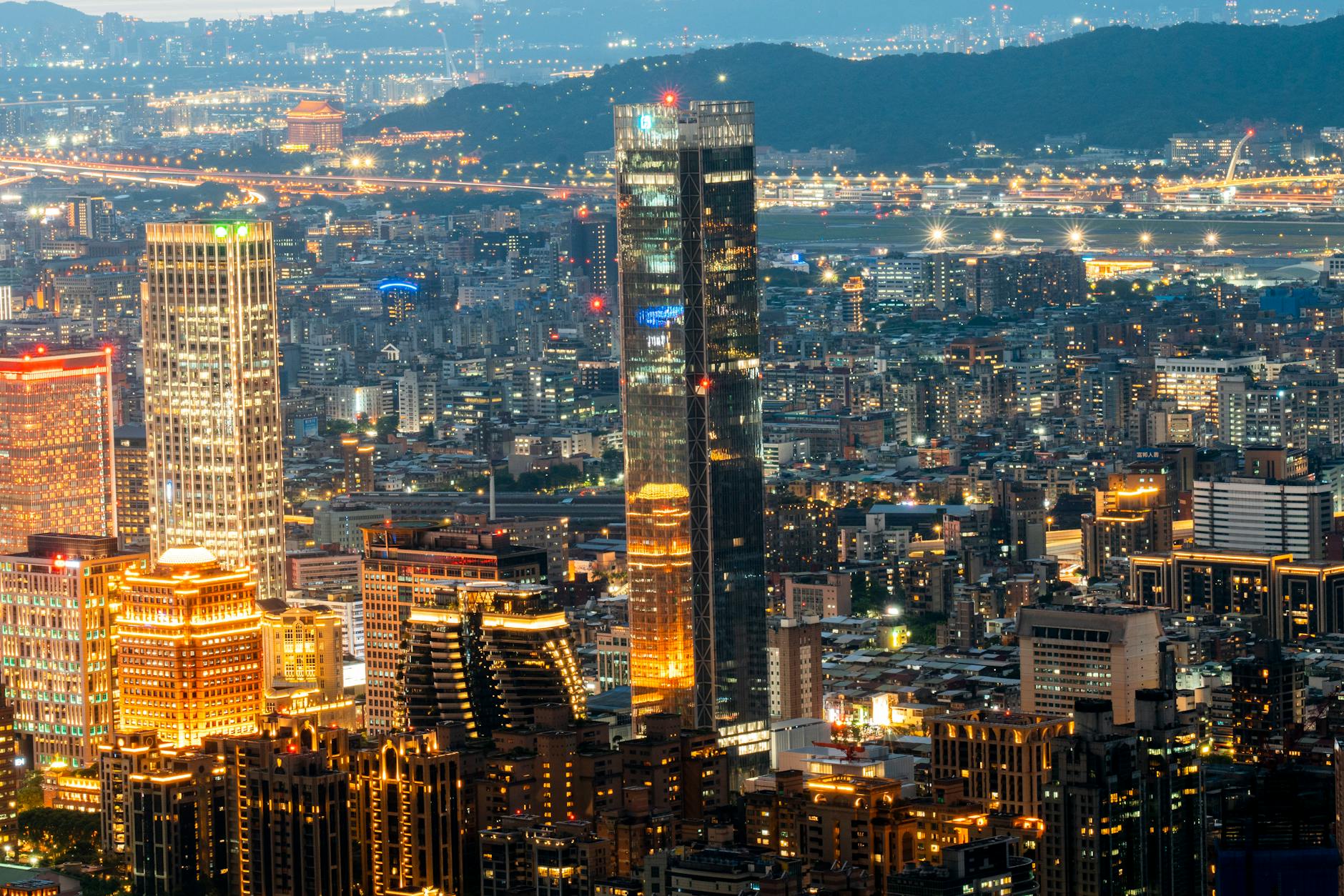 Taipei night skyline and business visitor report planning context.