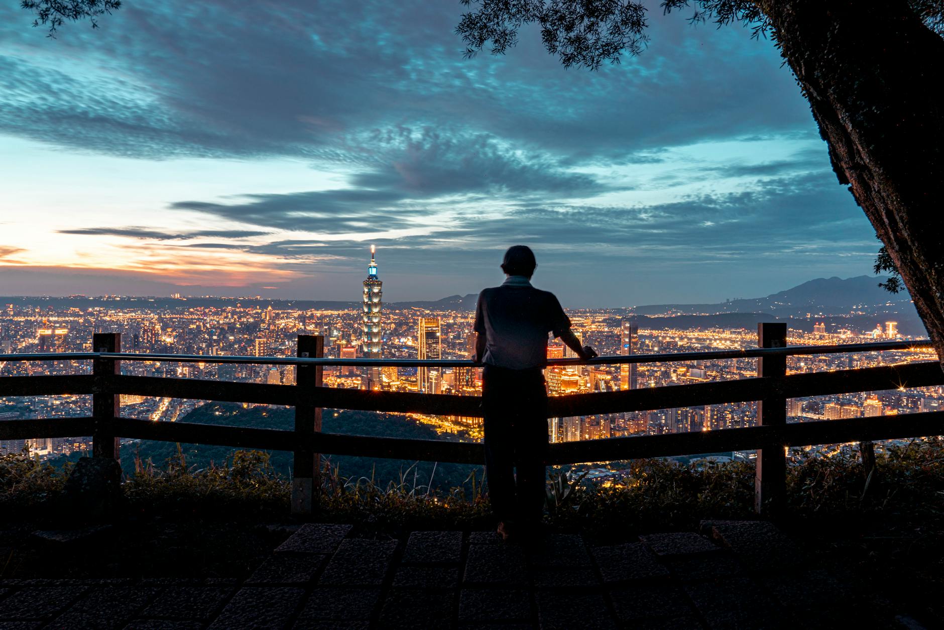 Taipei night skyline and conference attendee report planning context.