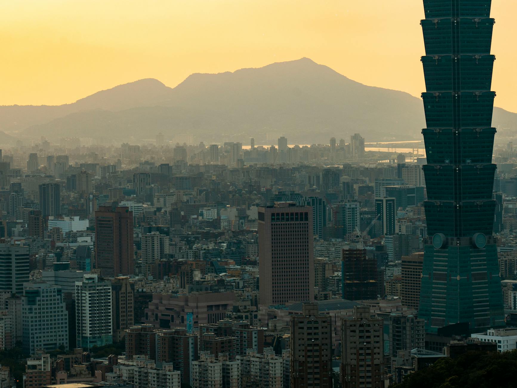 Taipei night skyline and consultant travel report planning context.