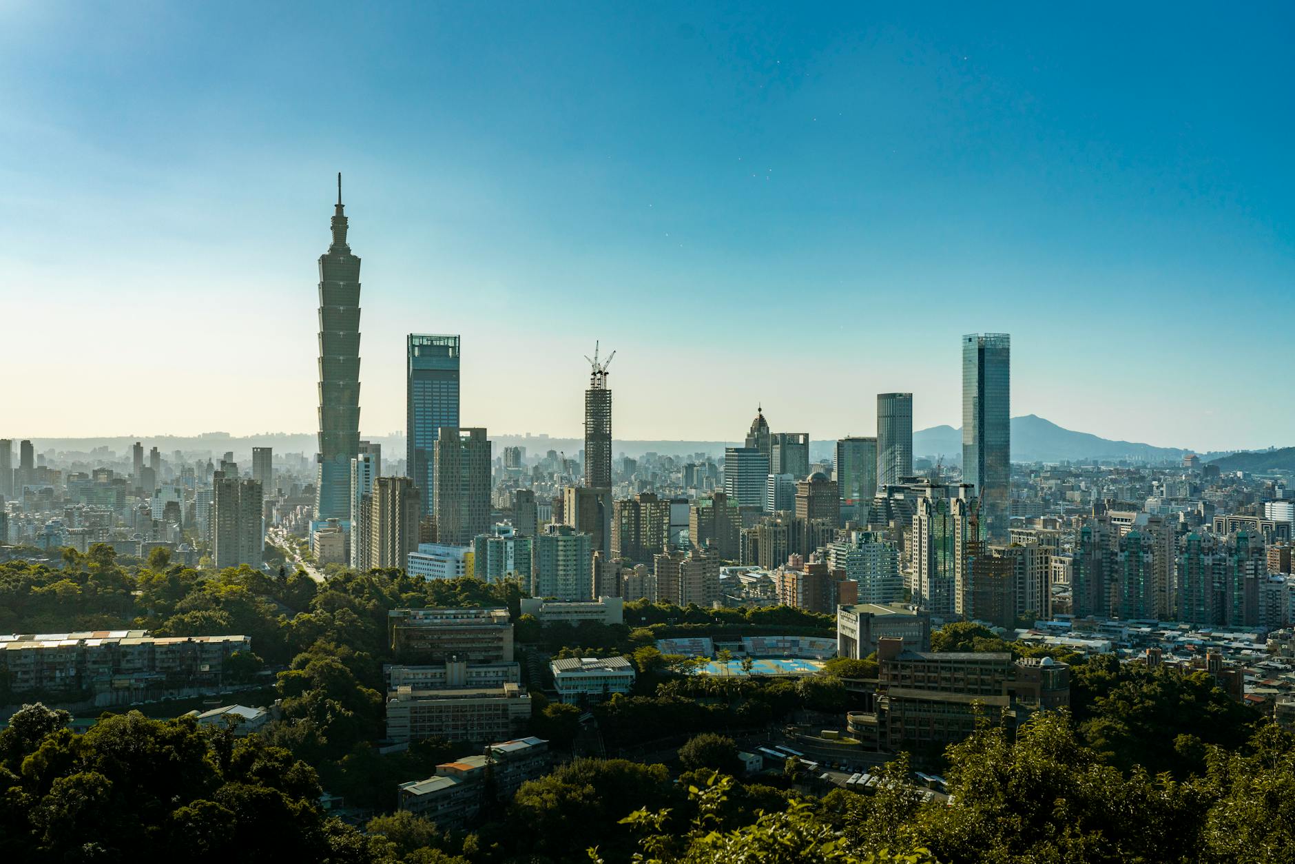Taipei night skyline and investor travel report planning context.
