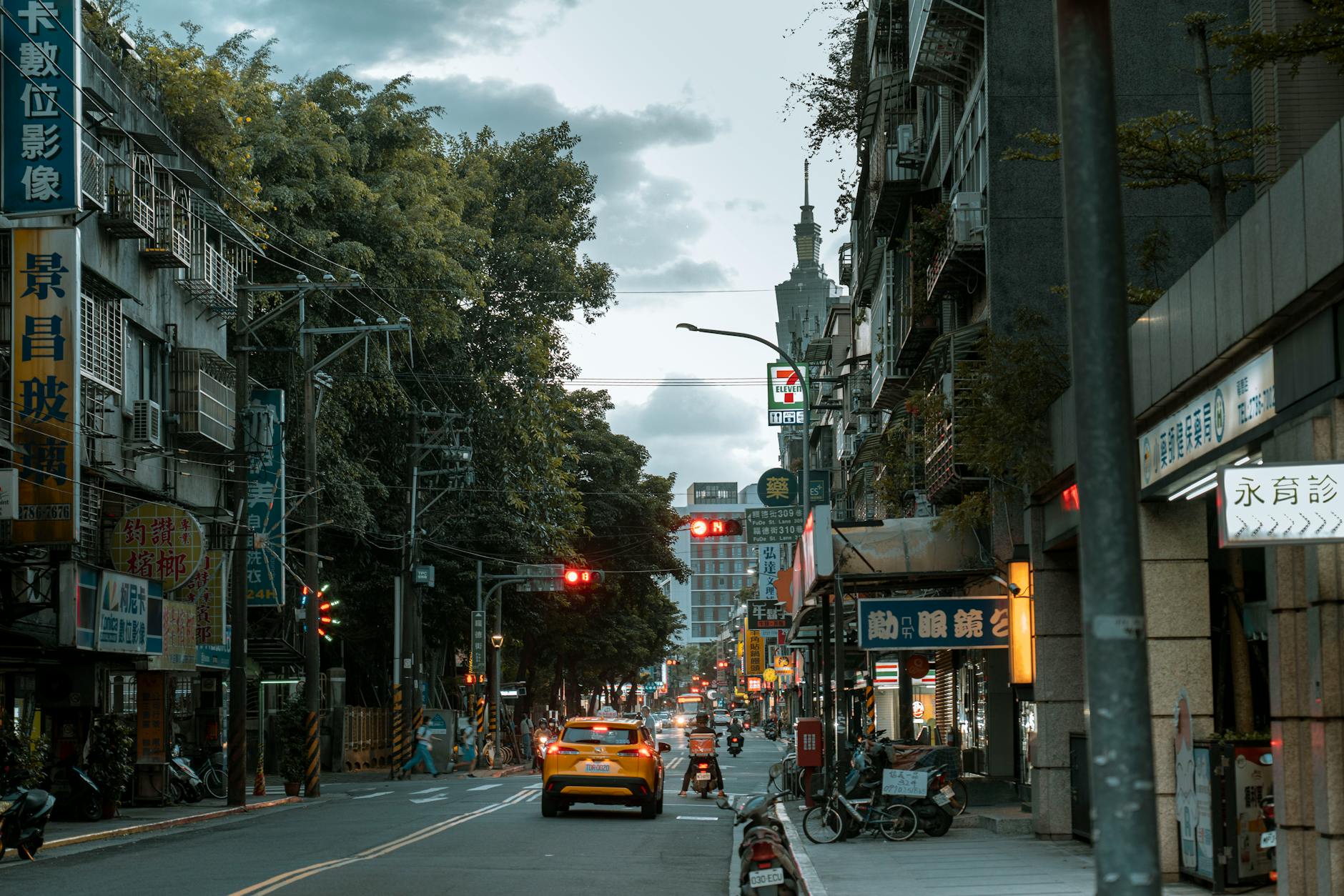 Rainy Taipei street and journalist safety planning context.