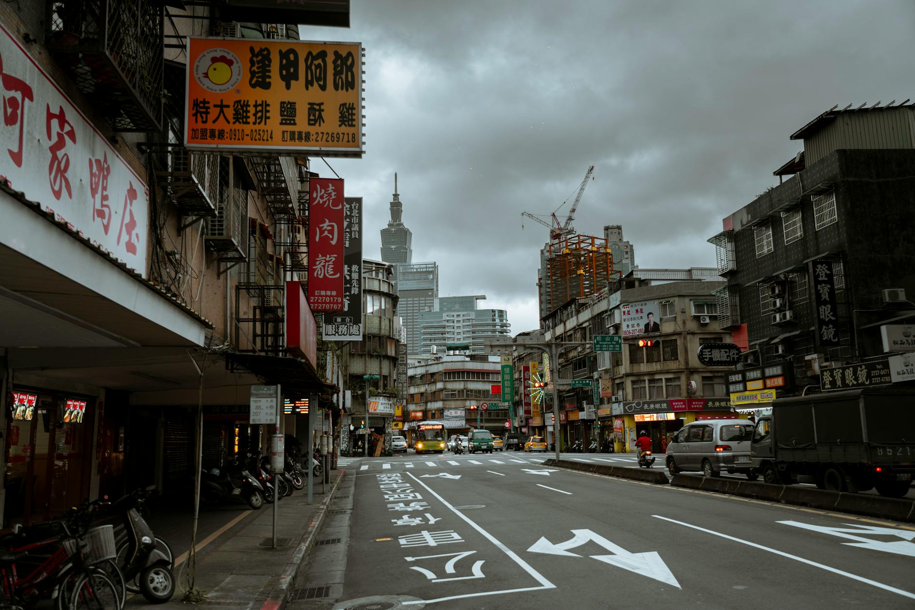 Taipei city street and journalist assignment planning context.