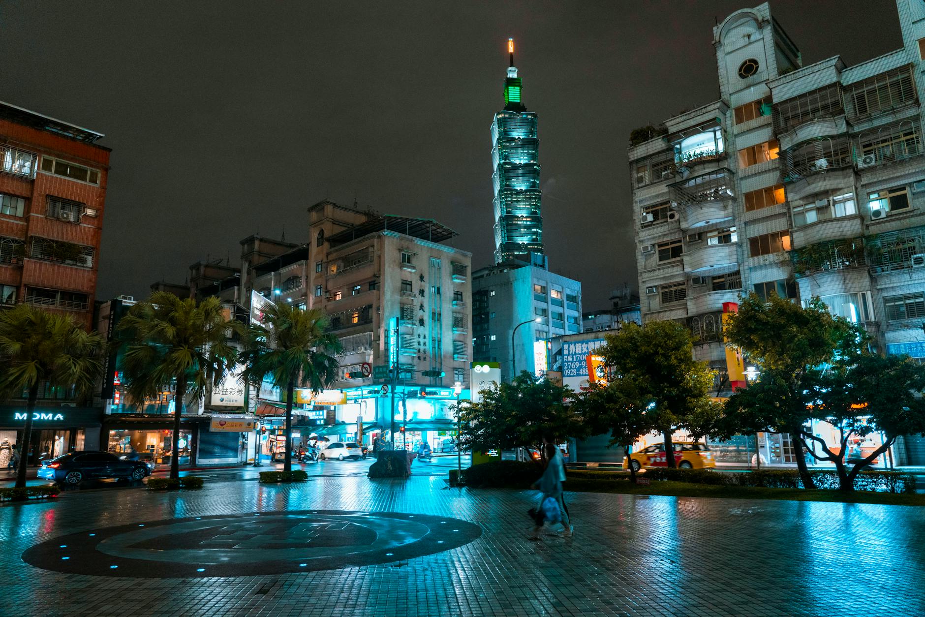 Taipei street and woman traveler planning context.