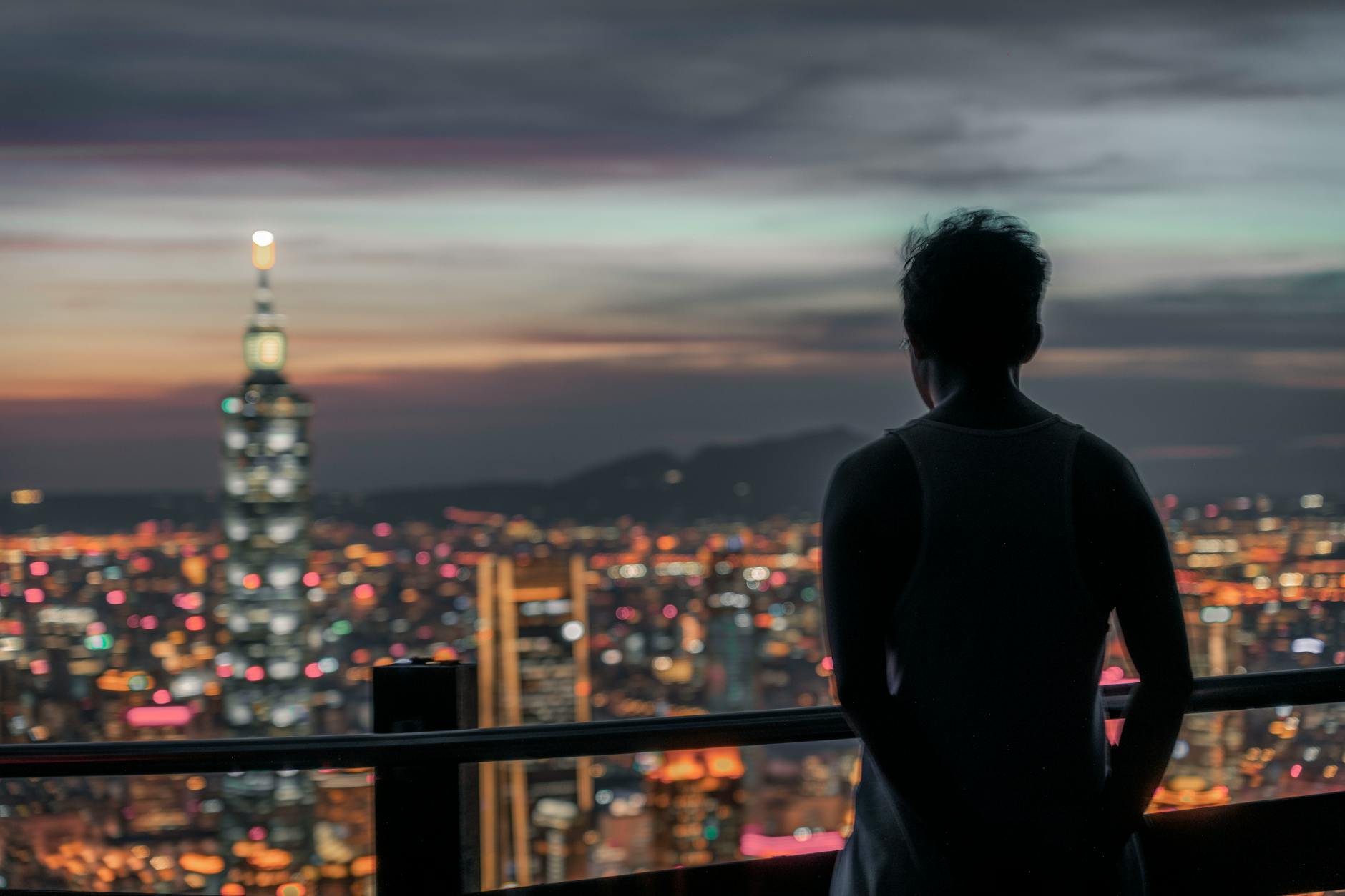 Taipei night skyline and woman traveler report planning context.