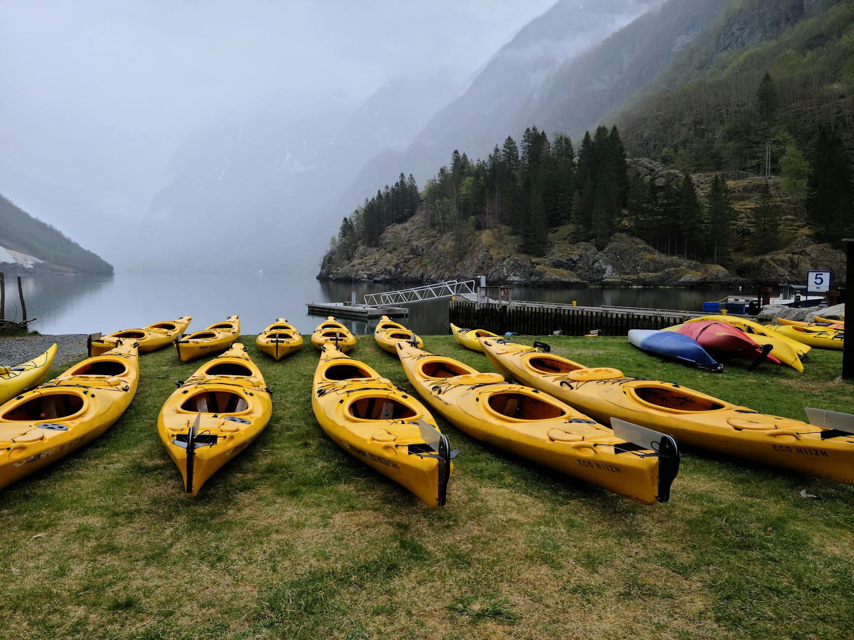Kayaks on a Norwegian fjord shore for Trondheim outdoor travel report planning.