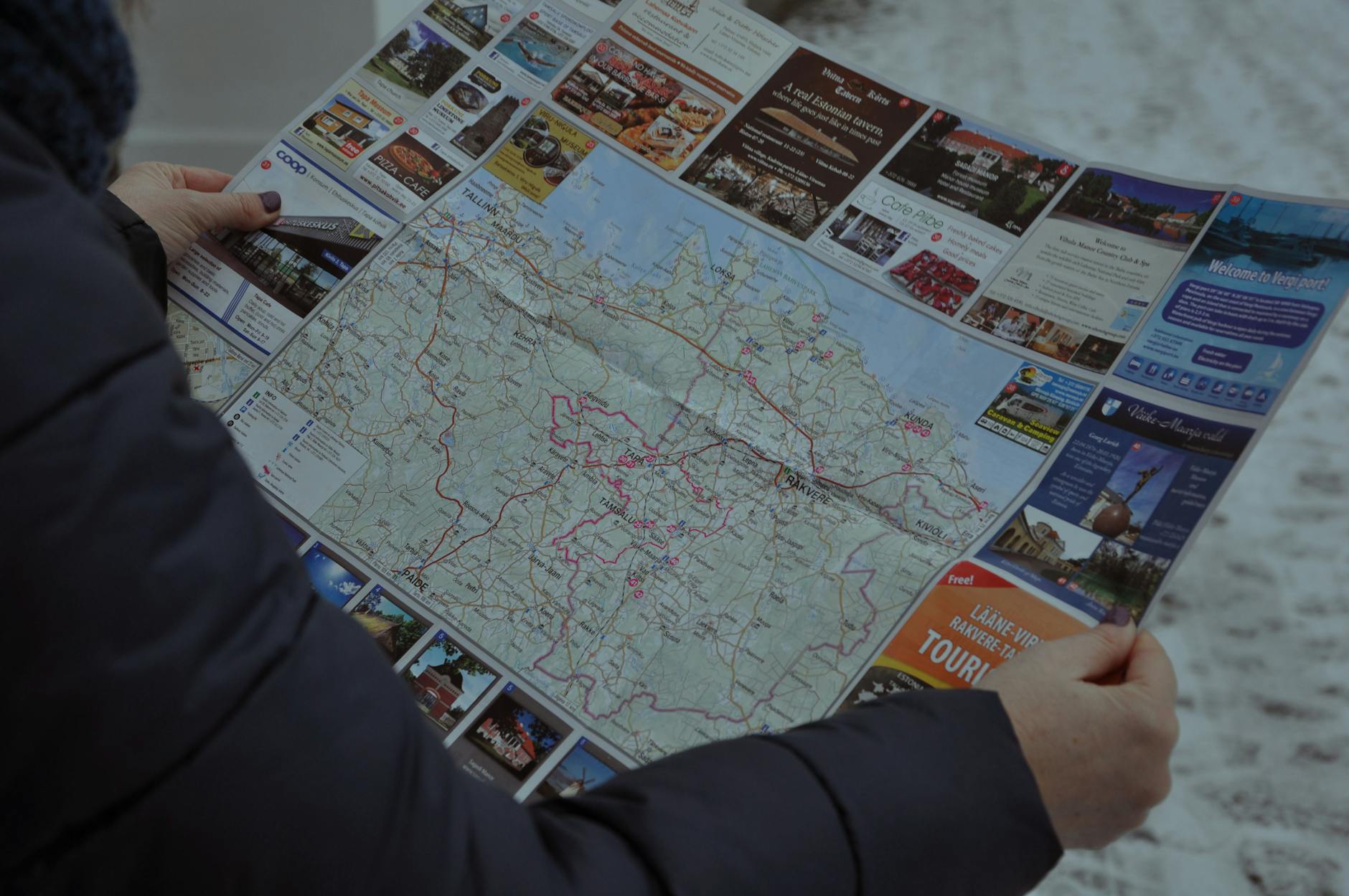Traveler reading a map for Trondheim budget trip planning.