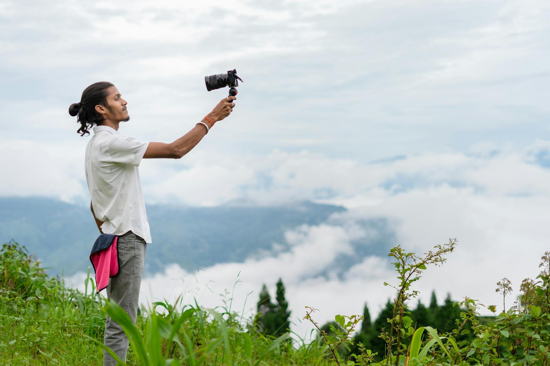 Creator filming a scenic landscape for Trondheim content planning.