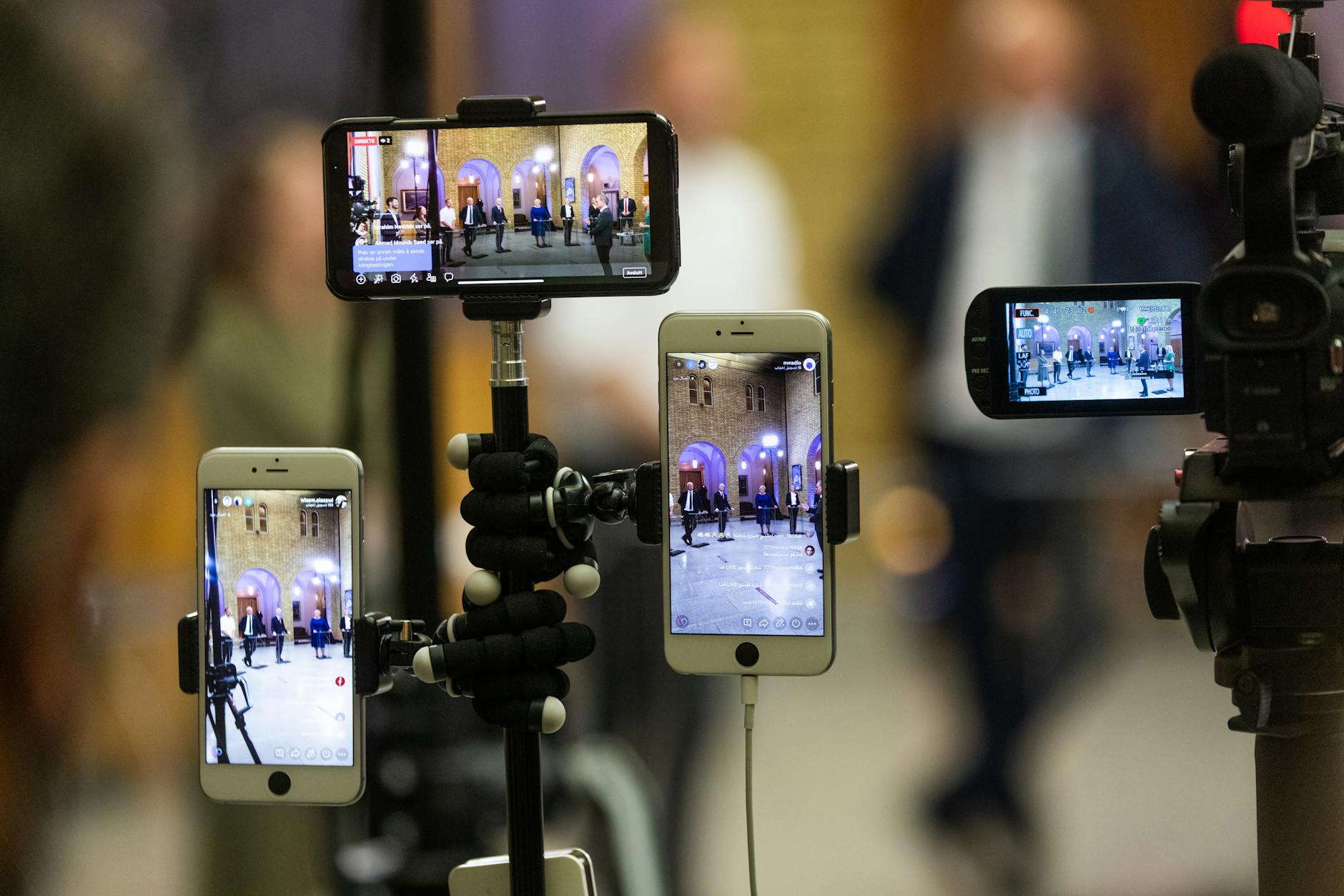 Smartphones on tripods for Trondheim content creator travel report planning.