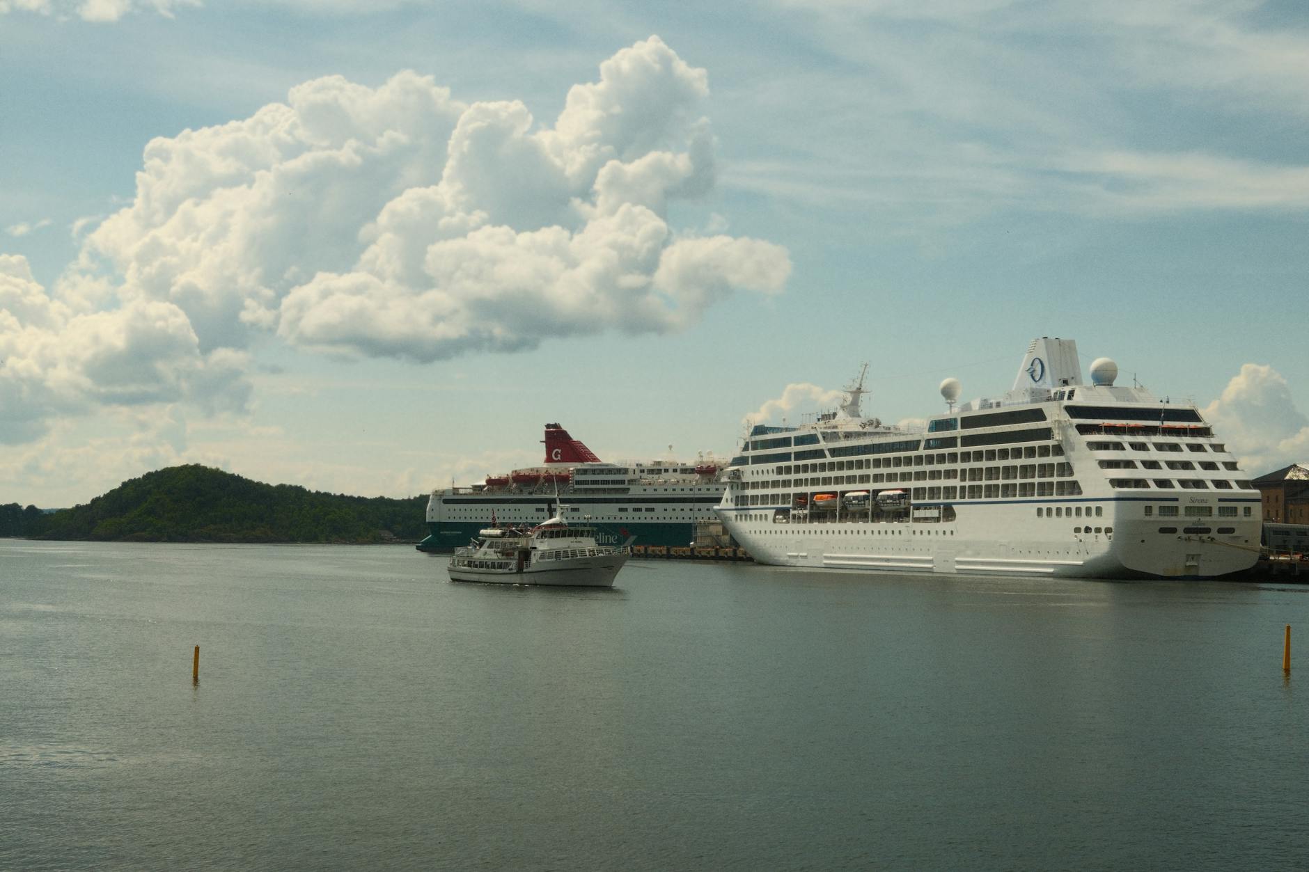 Cruise ships docked at a scenic port for Trondheim port-call planning.