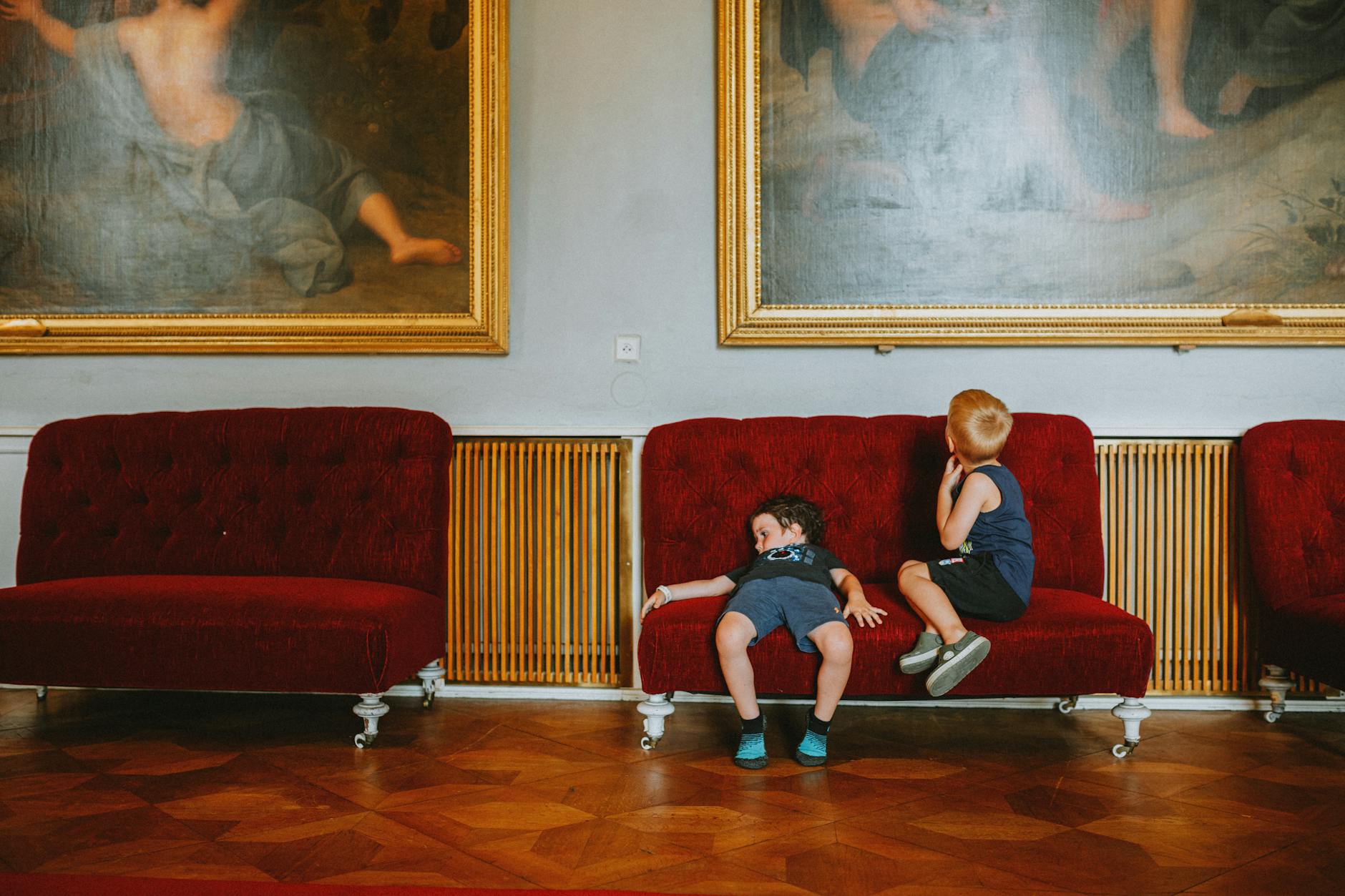 Children resting in a museum setting for Trondheim family break planning.