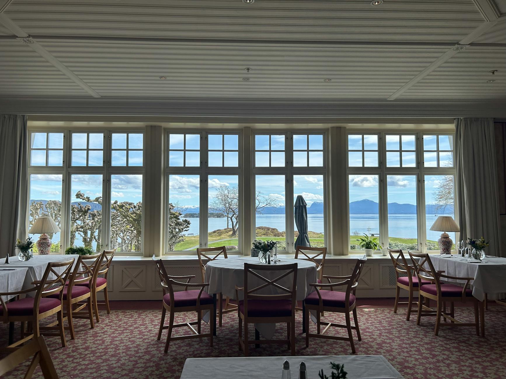 Scenic dining room with fjord view for Trondheim luxury meal planning.