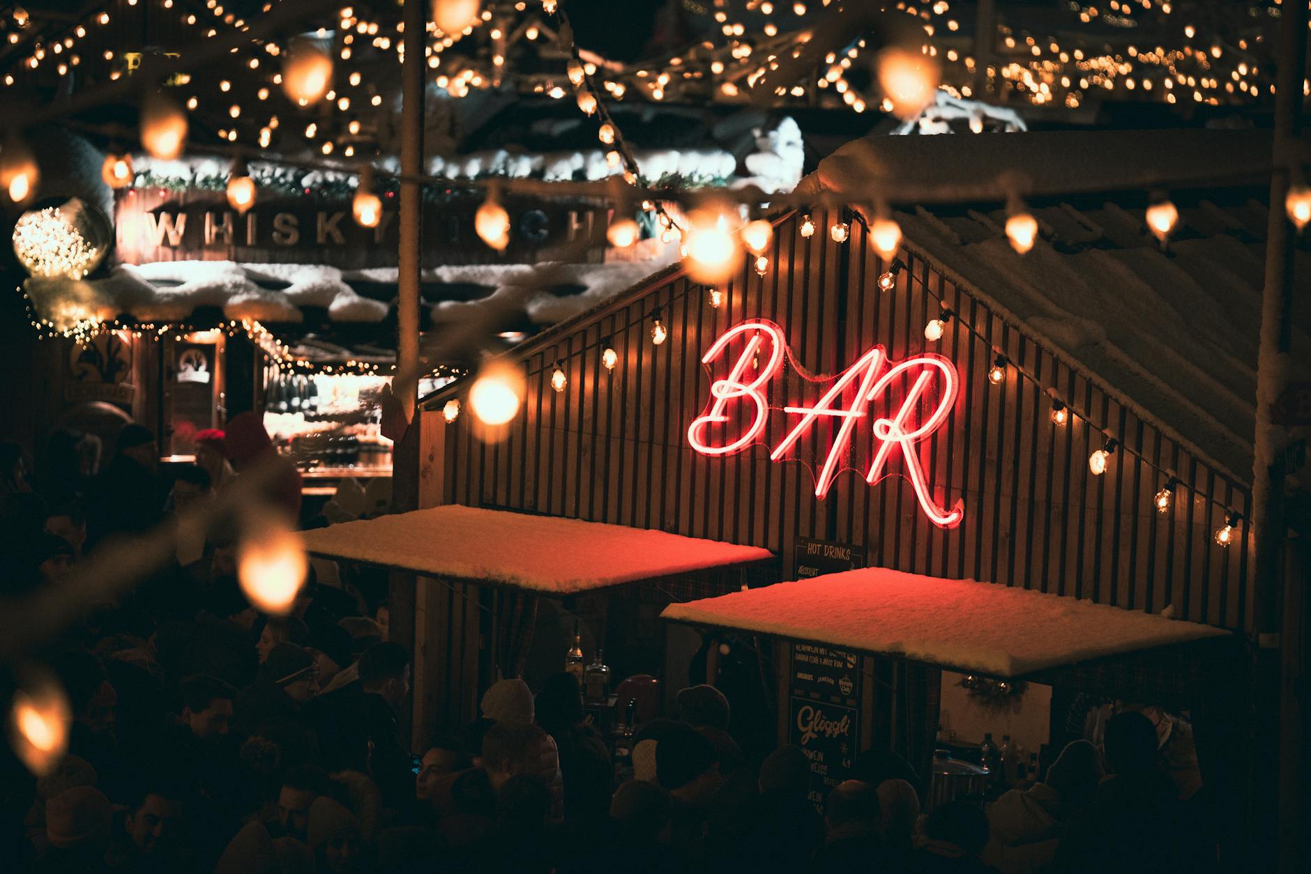 Festive neon-lit bar for Trondheim nightlife safety planning.